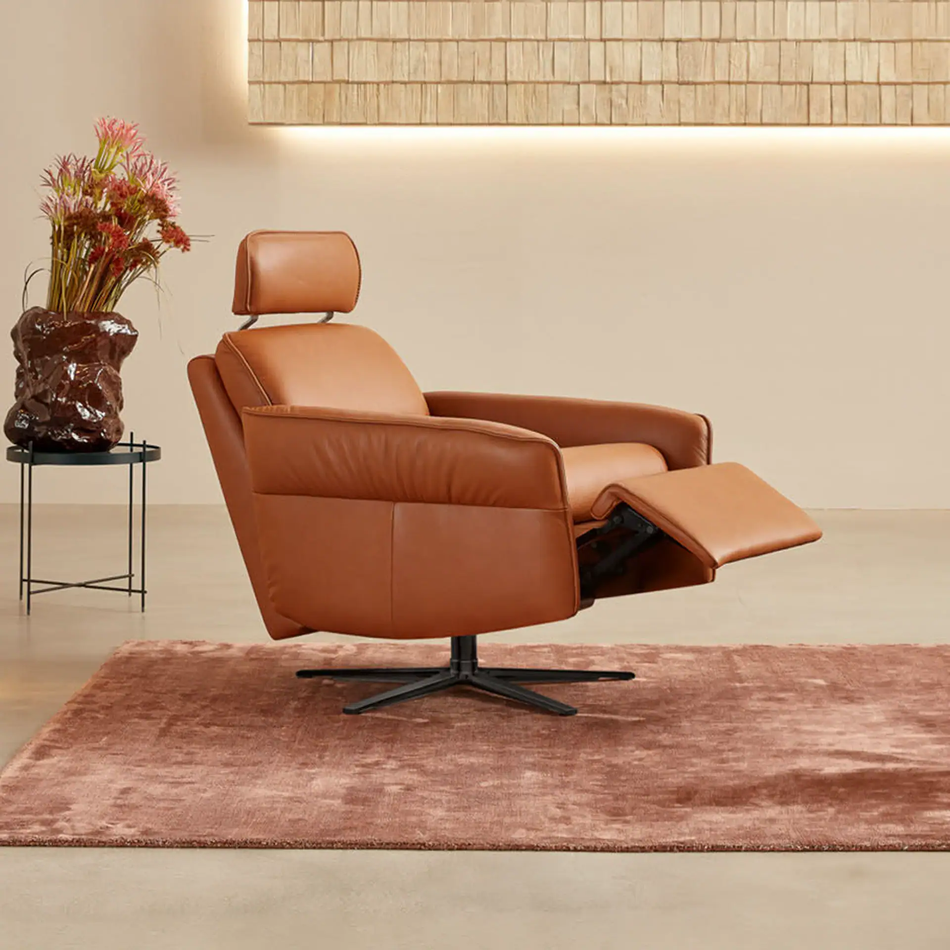 Aura Swivel Recliner Chair with adjustable footrest and plush leather upholstery for ultimate comfor.