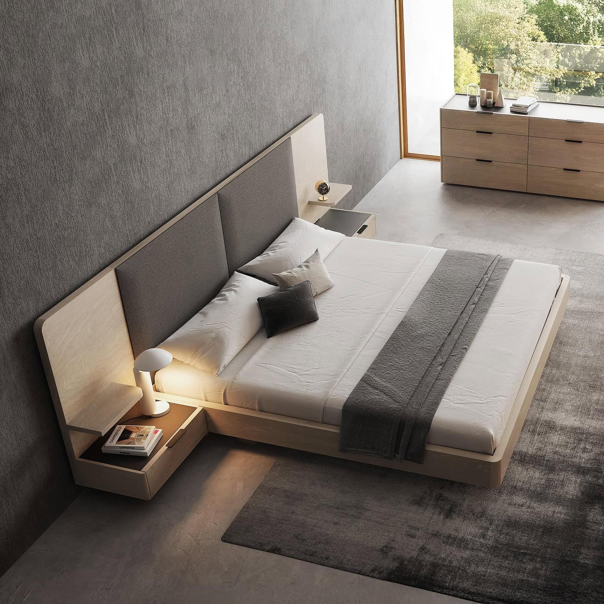 Contemporary bedroom with modern wooden furniture and upholstered headboard, natural lighting, minimalist decor.