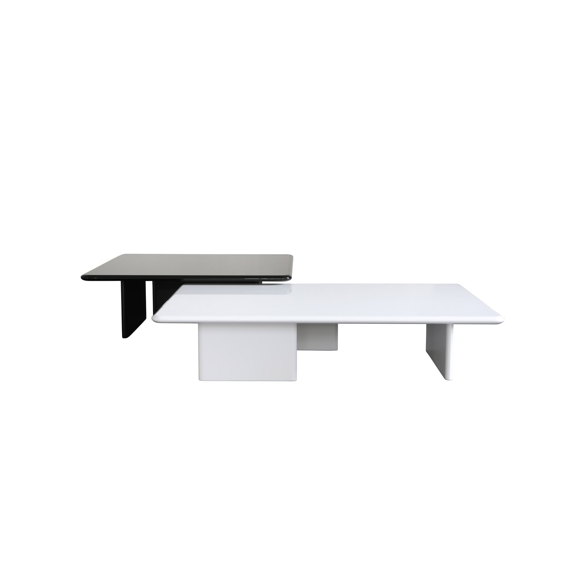 Contemporary modular coffee tables in black, white, and gray with geometric design.