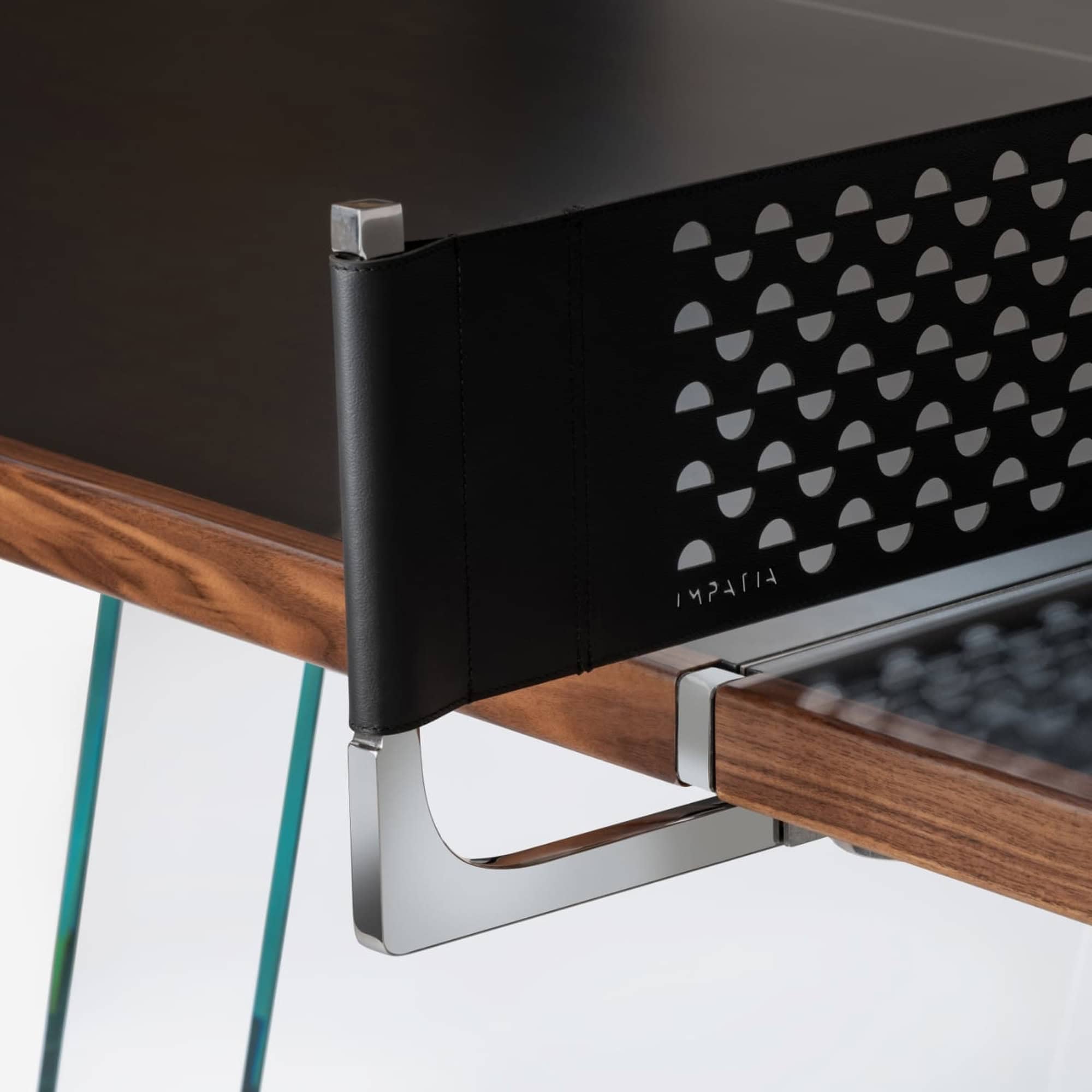 High-quality modern desk with perforated black leather privacy panel and sleek metal accents.