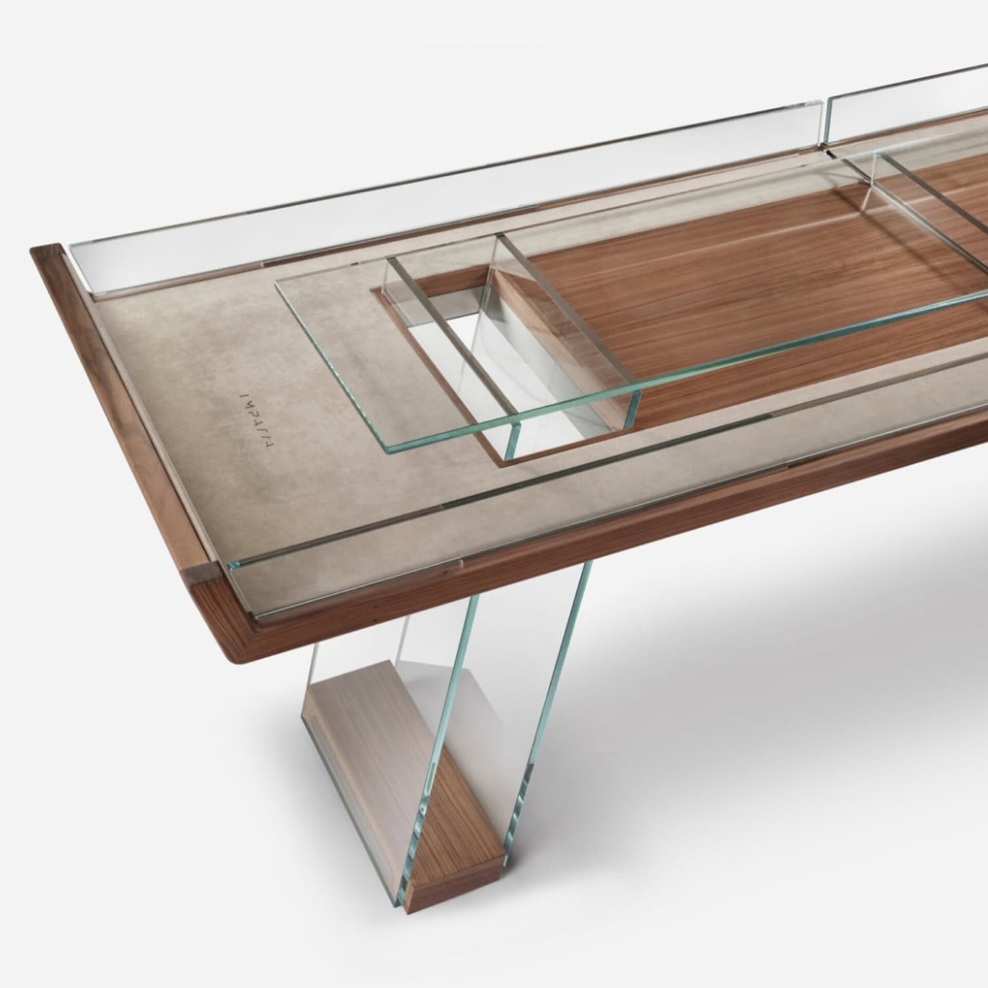 Contemporary glass and wood dining table with sleek modern design for stylish interiors.