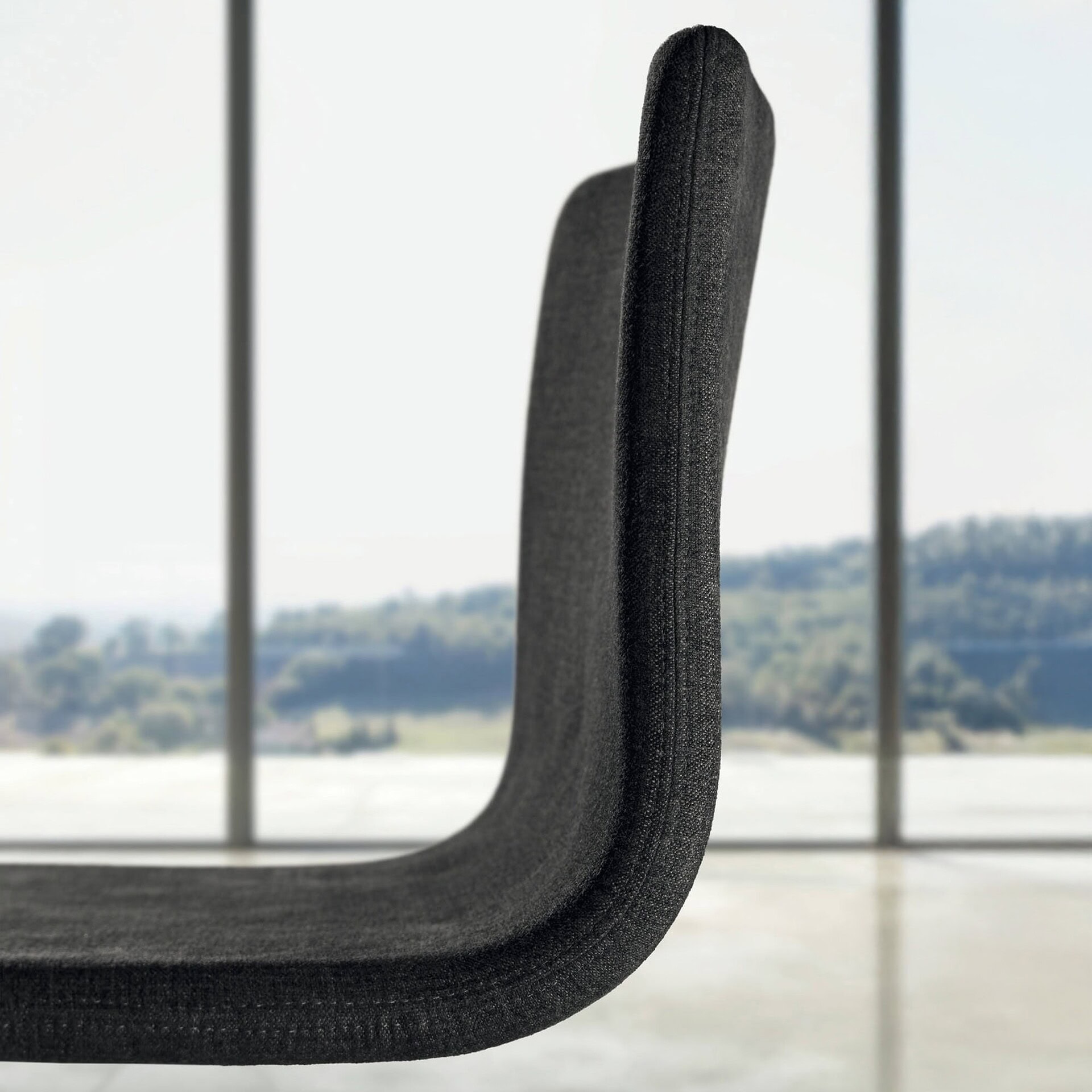 Contemporary black fabric office chair with sleek design and ergonomic comfort.