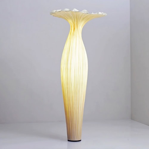 Elegant tall decorative vase with floral top, modern design by Sklar Furnishings.