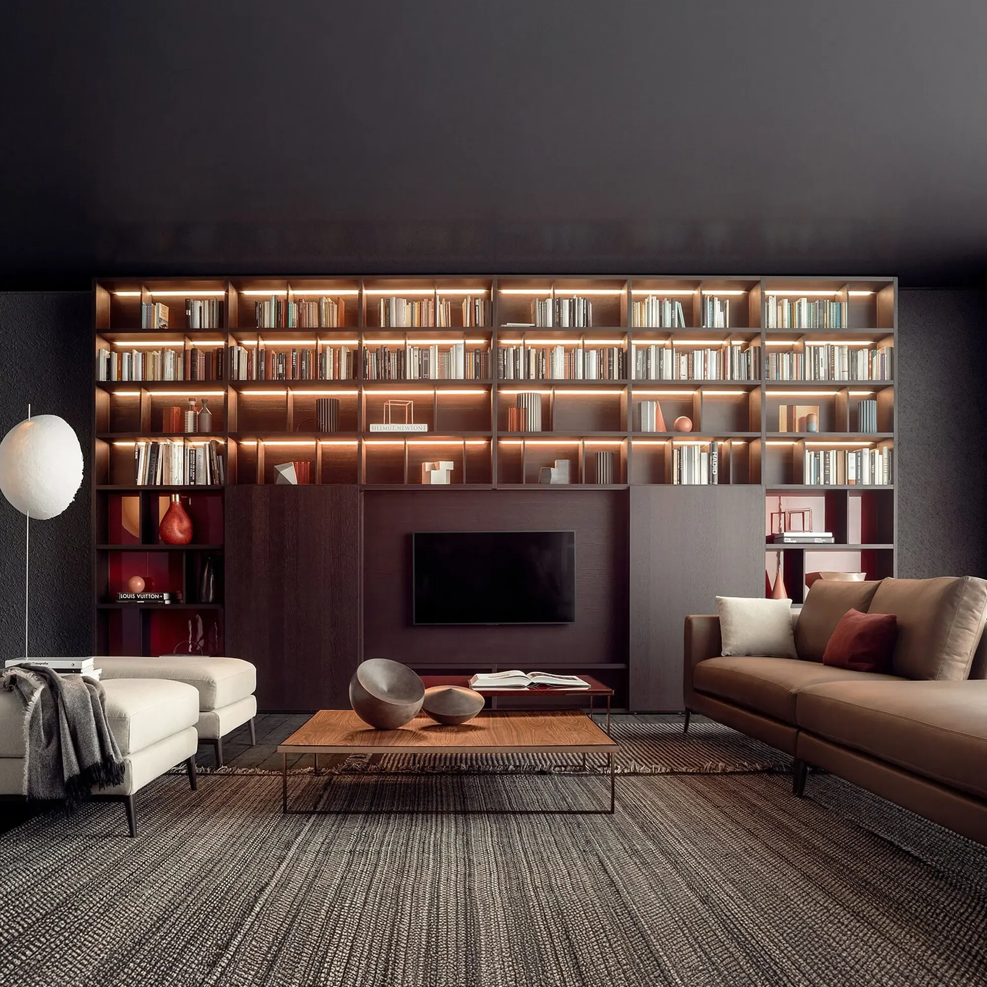 Spazioteca modular wall unit in a modern living room with built-in bookshelf and media wall.