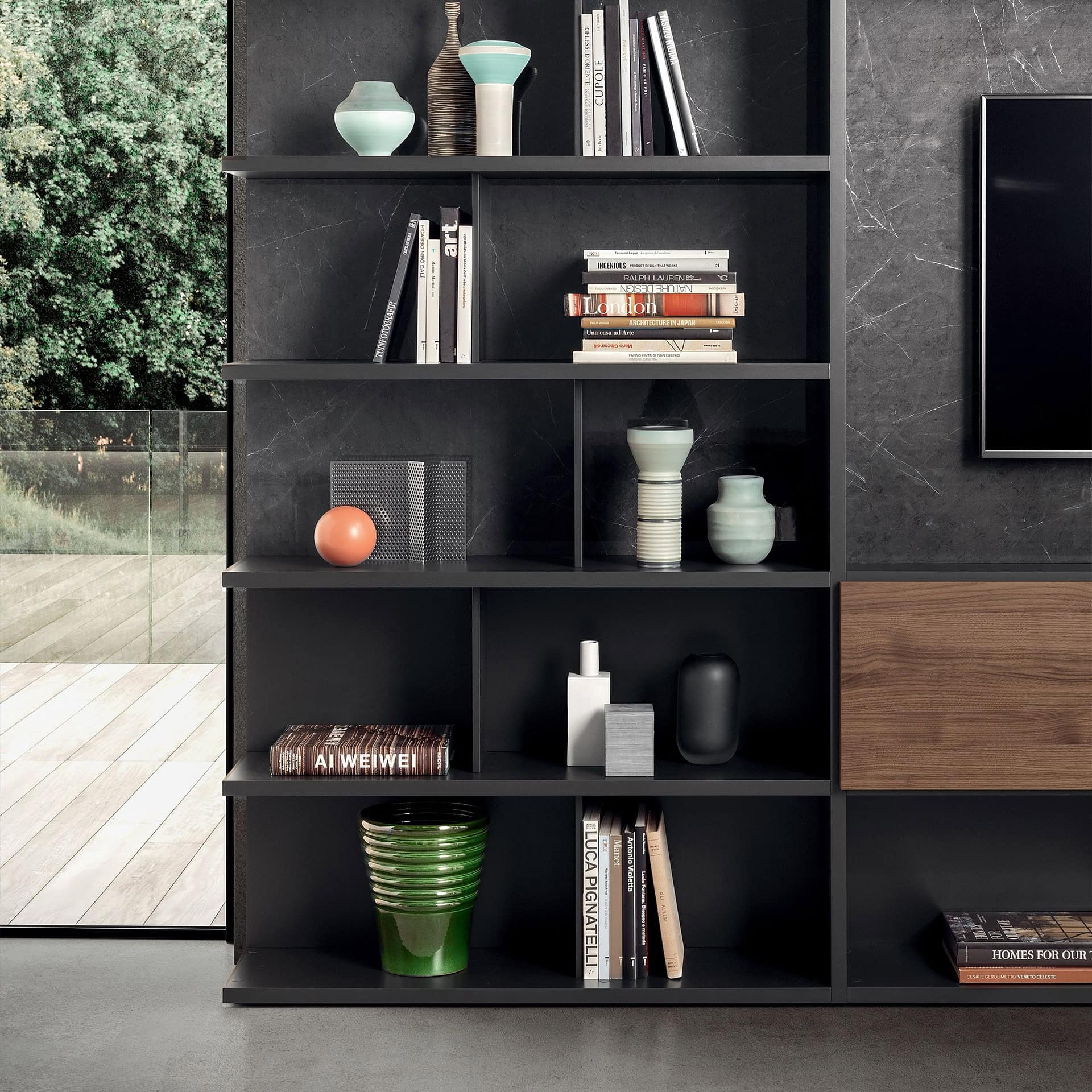 Shelf decor featuring contemporary vases, books, and art pieces in a modern living space.