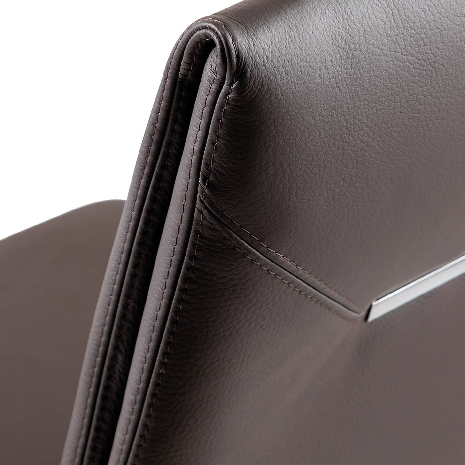 Smooth brown leather upholstery detail on a luxury Sklar Furnishings chair or sofa.