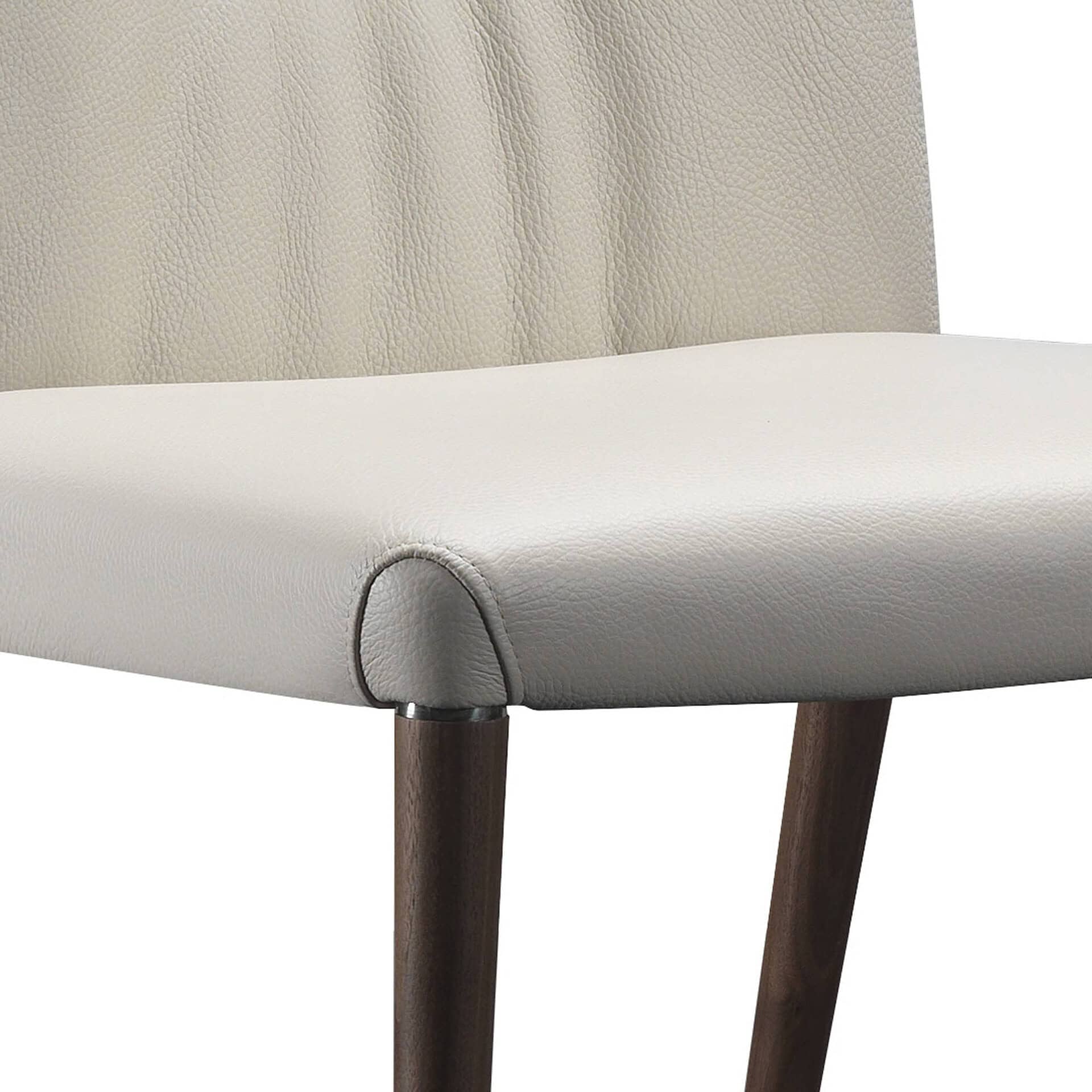 Elegant cream-colored leather accent chair with wooden legs, modern and stylish for contemporary living spaces.