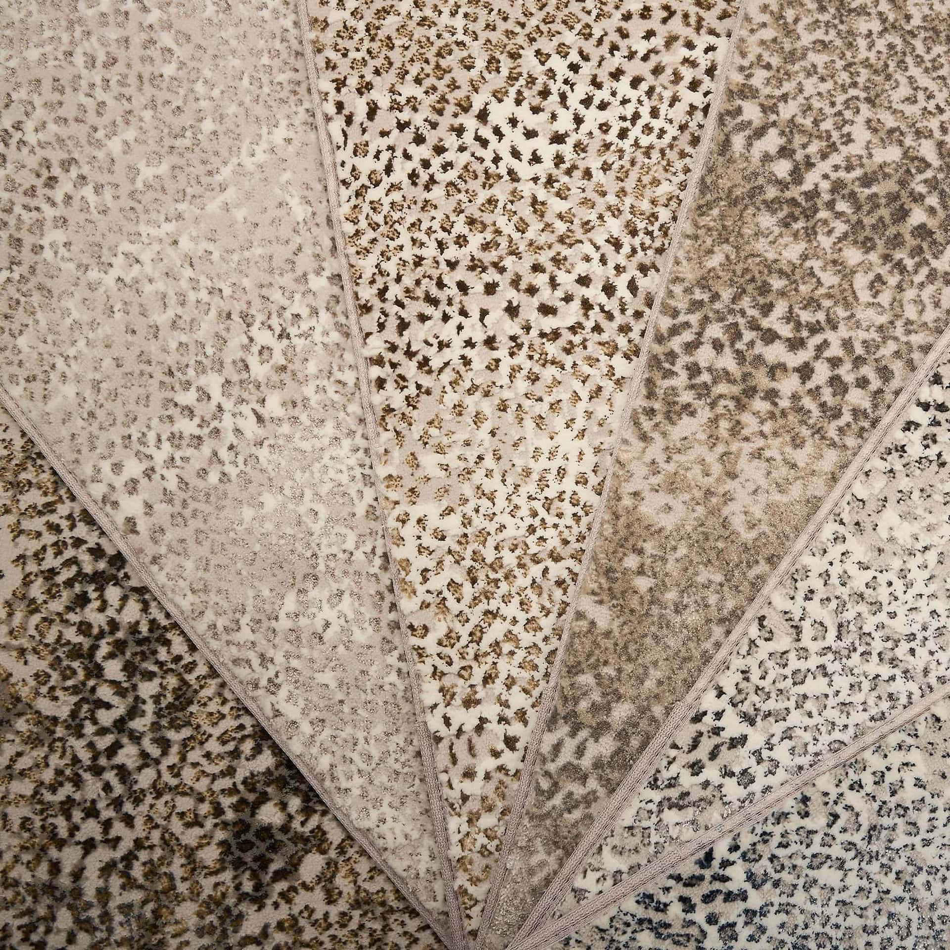 Patterned fabric samples showcasing various leopard and animal print designs by Sklar Furnishings.