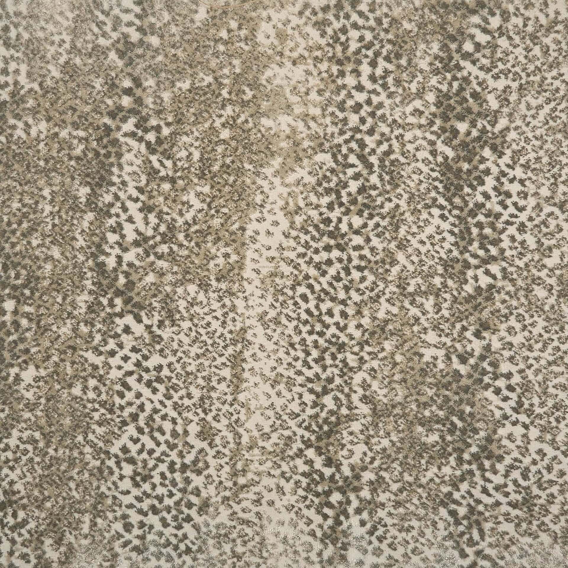 Animal print upholstery fabric in beige and brown tones for furniture design.