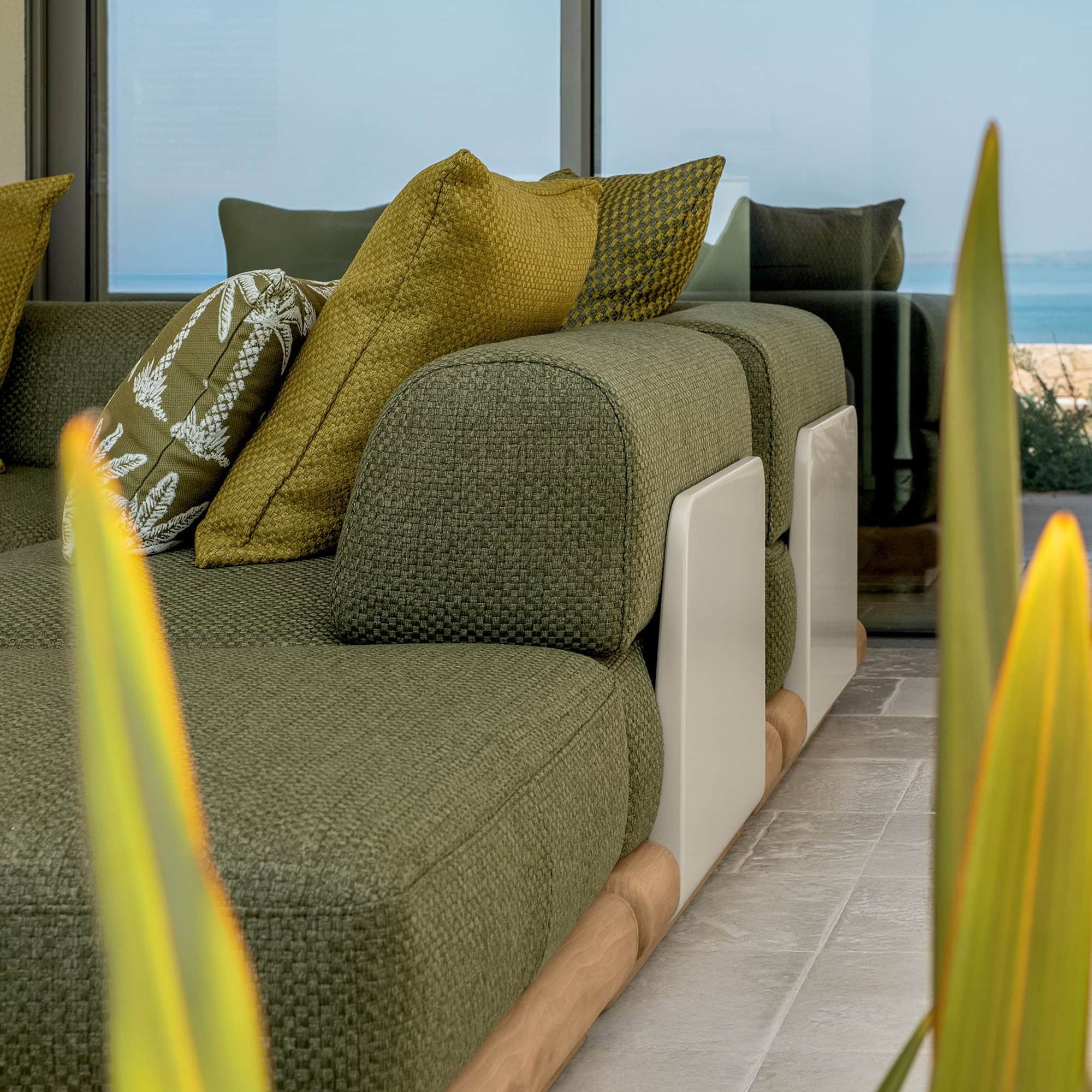 Luxurious green sectional sofa with contemporary design, perfect for modern living rooms and coastal homes.