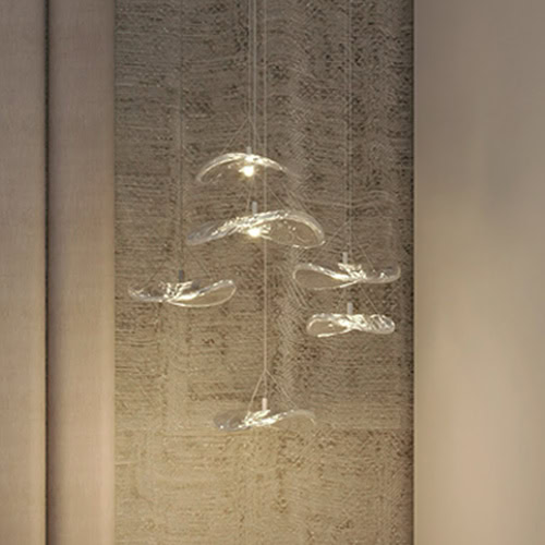 Glass pendant lighting fixture for modern interior decor.