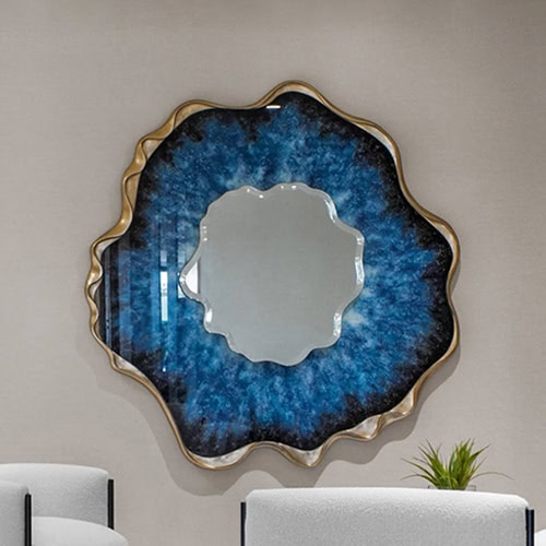 Vivid blue and gold abstract wall mirror, luxurious modern home décor piece.