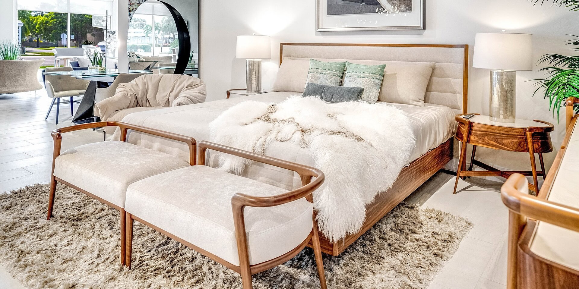 Contemporary bedroom with wooden furniture, plush bedding, and elegant lighting, featuring modern and minimalist design elements.