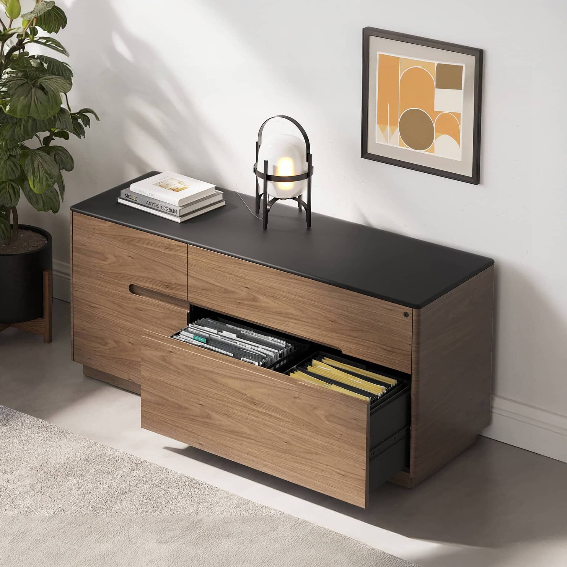 Contemporary wooden sideboard with black top, modern decor, and storage drawers.