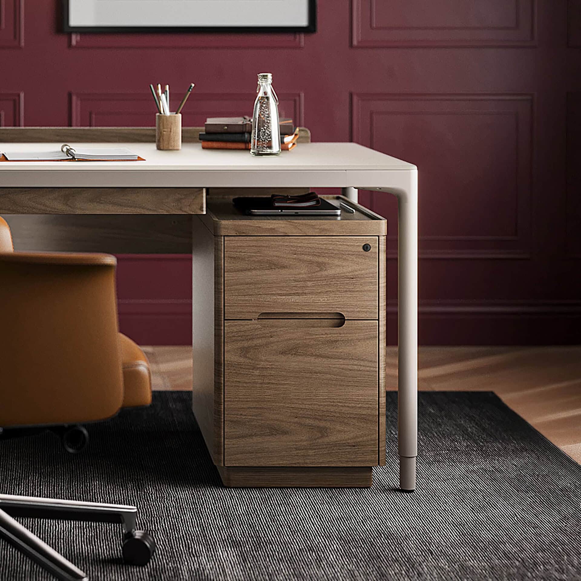 Sustainable wooden mobile file cabinet in an office space with burgundy wall panels.