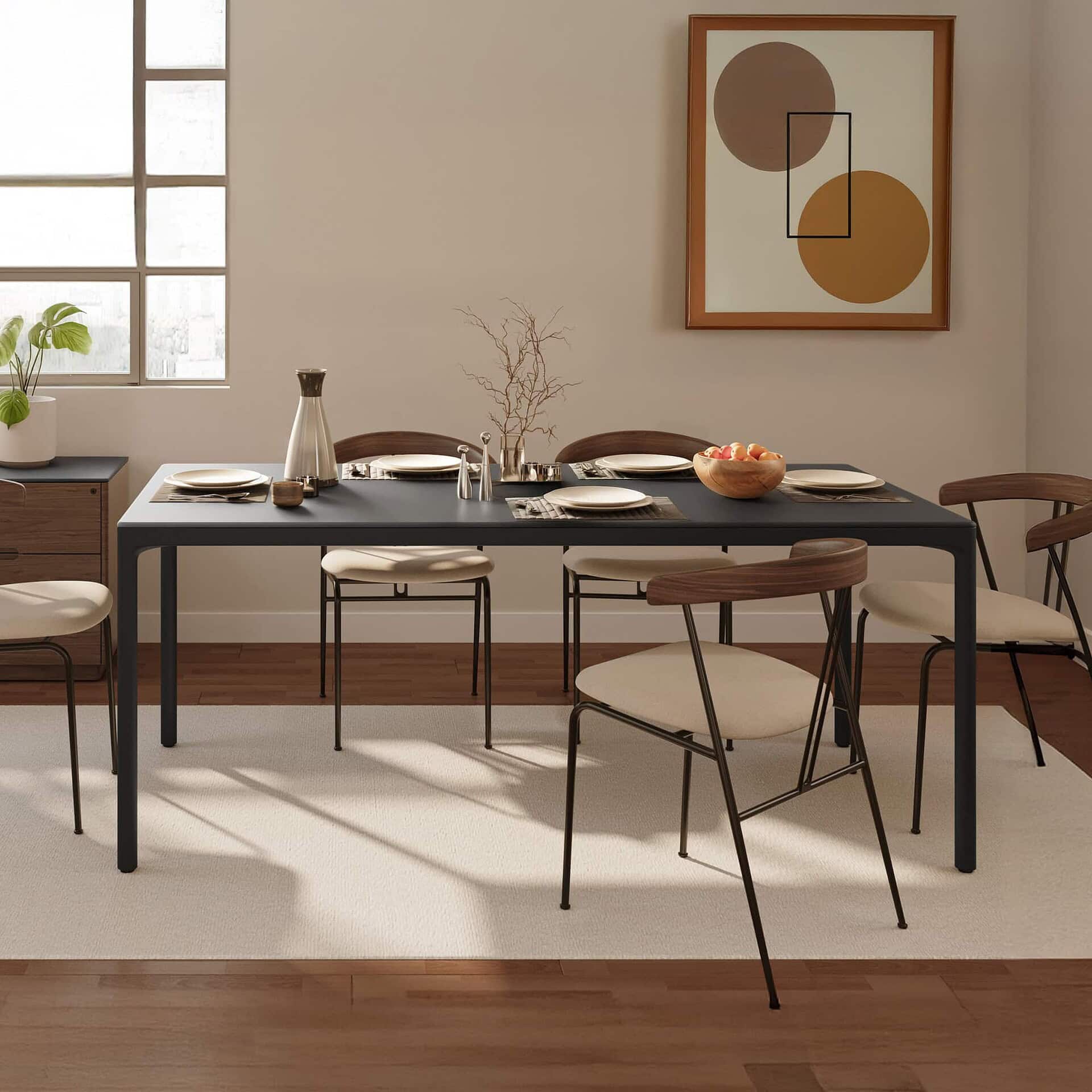 Stylish modern dining room table with minimalist chairs, elegant decor, and contemporary artwork for sophisticated interior design.