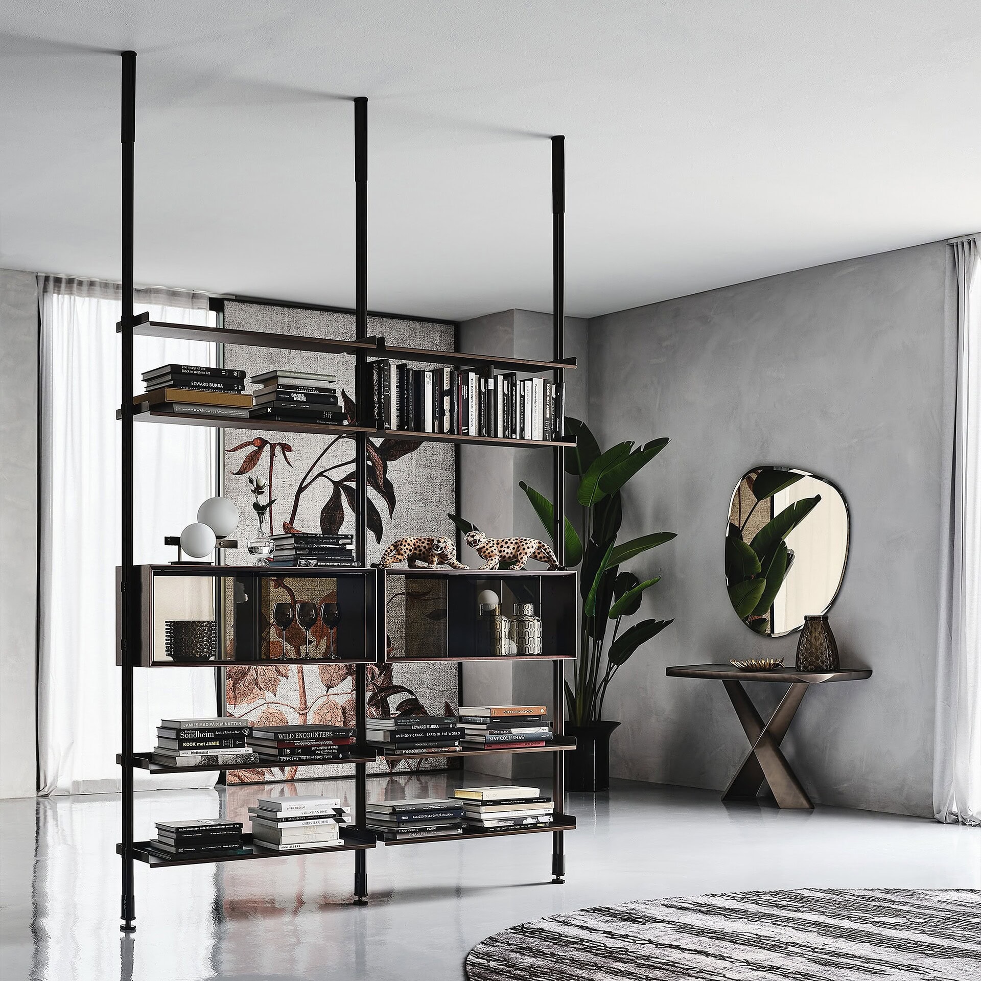 Sophisticated black metal and glass bookshelf with decorative accents in modern living room.