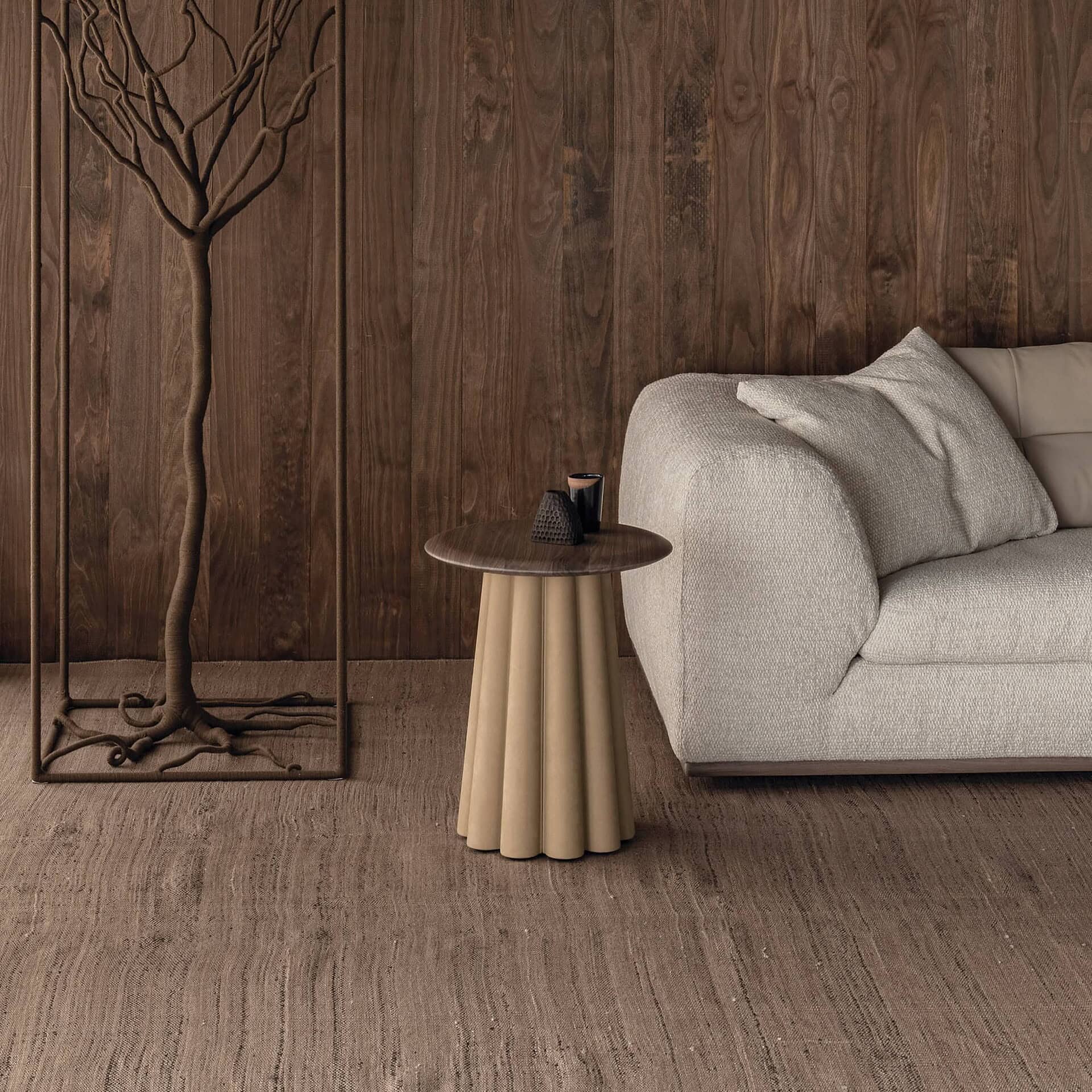 Contemporary living room with neutral sofa, wooden side table, and textured wall decor from Sklar Furnishings.