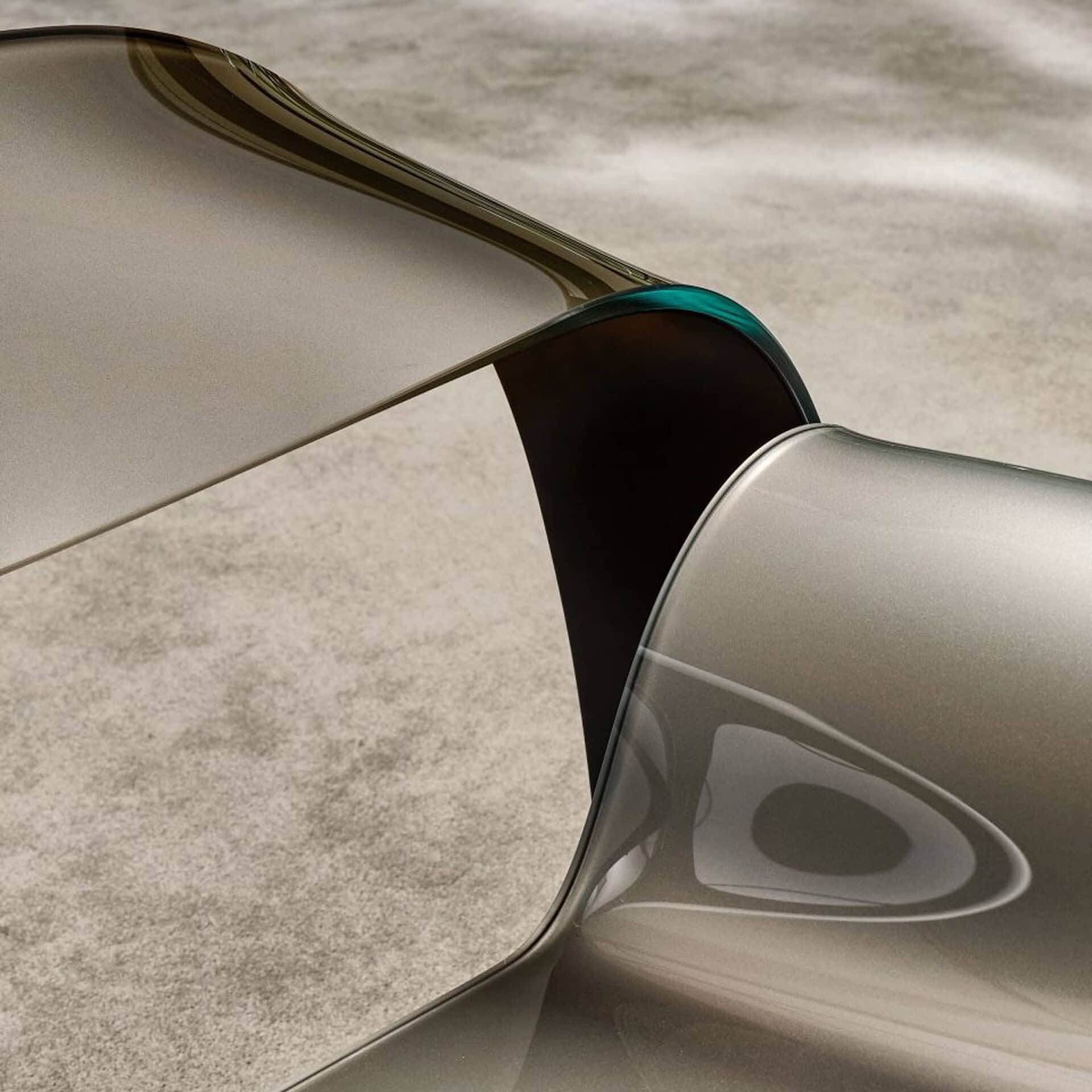 Sleek modern furniture with metallic finish, emphasizing contemporary design and craftsmanship.