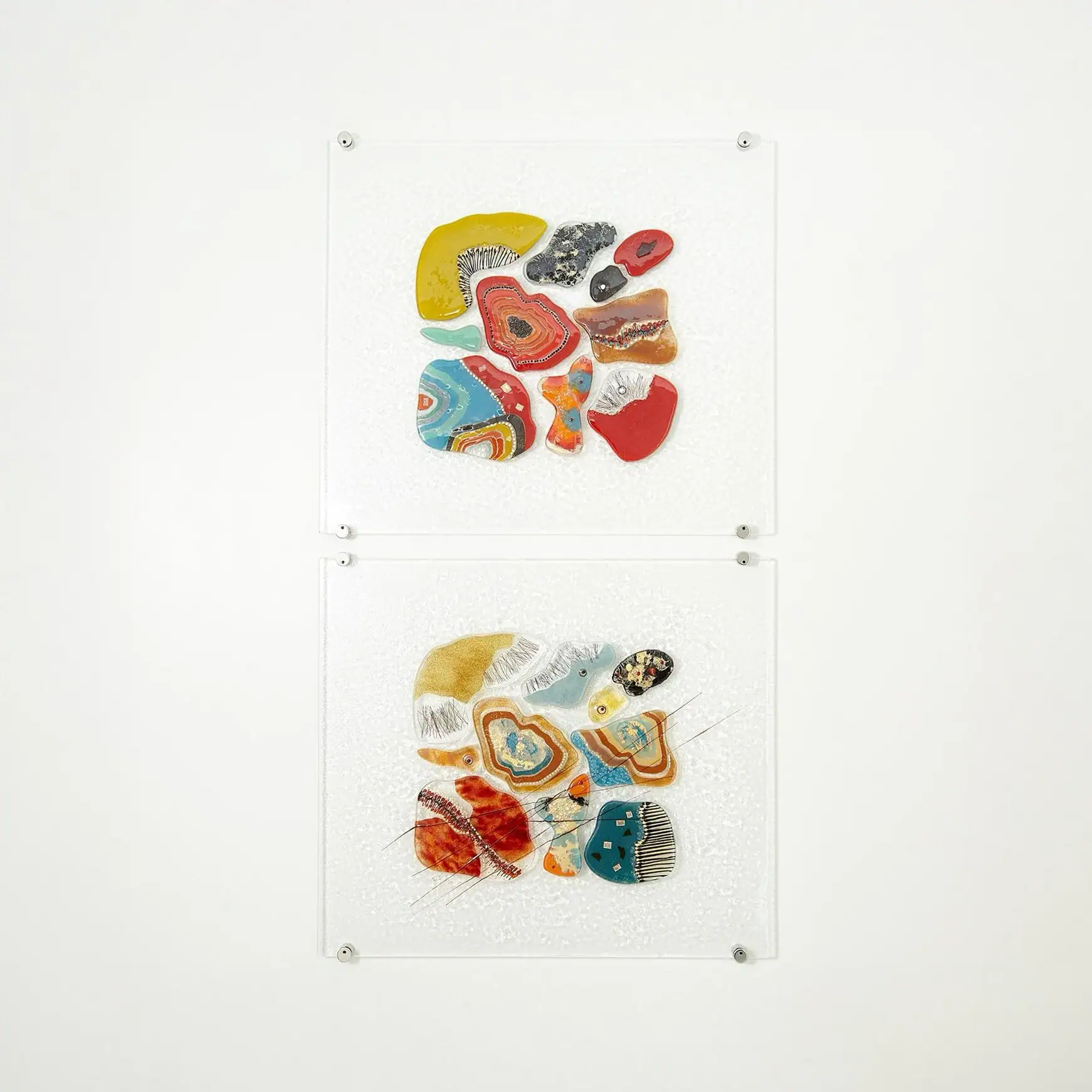 Colorful abstract glass art pieces on display at Sklar Furnishings. Unique contemporary home decor and art collection.