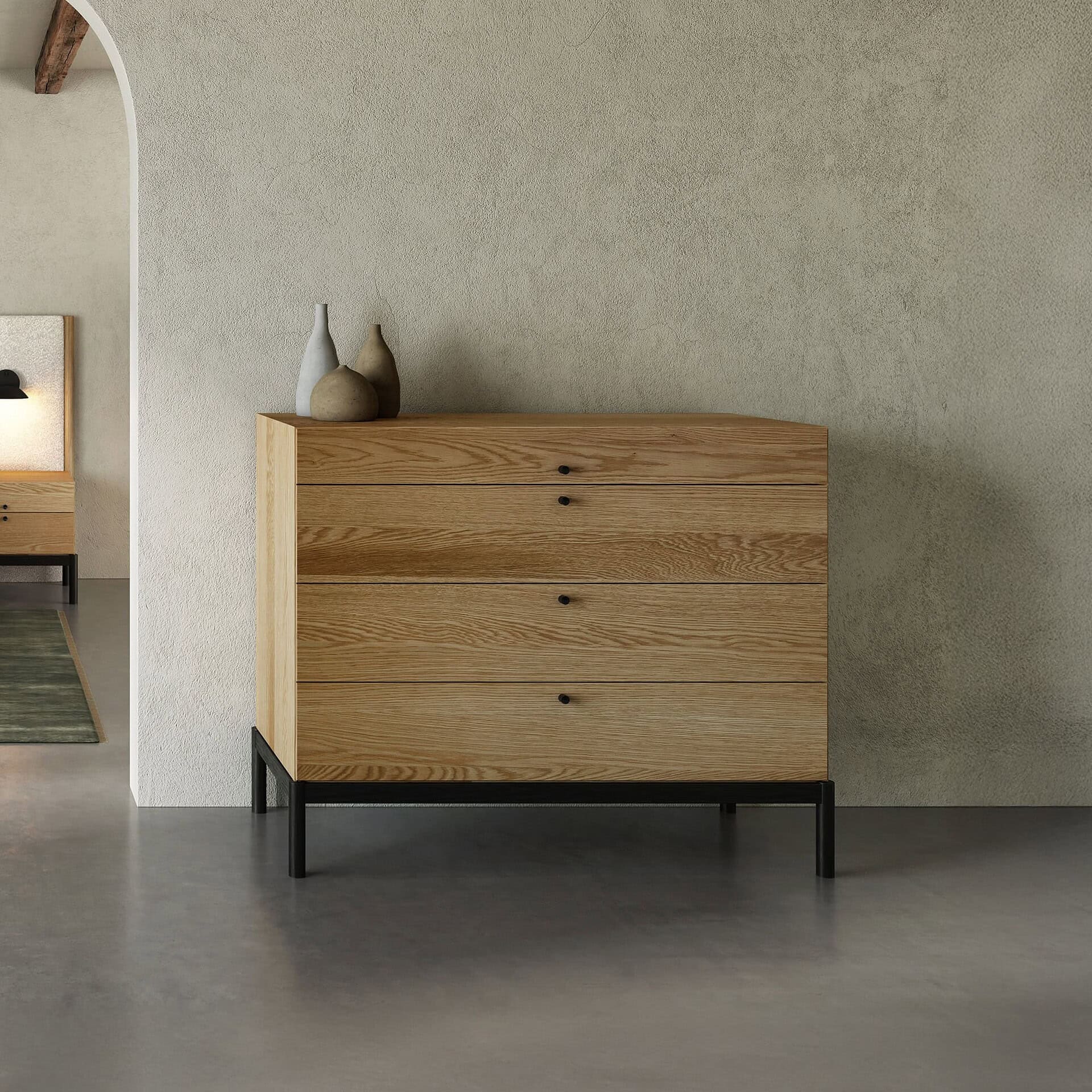 Sleek modern wooden dresser with black metal legs, minimalist decor for contemporary homes.