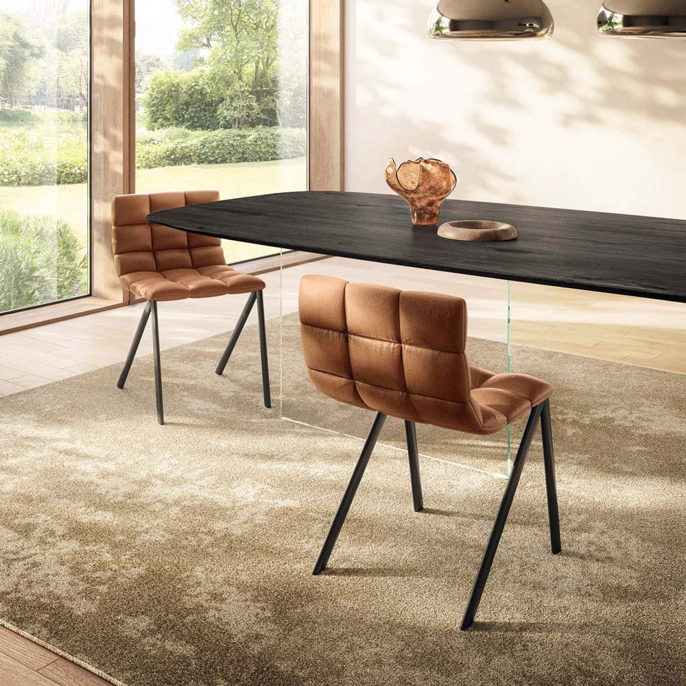 Contemporary dining table with brown leather chairs and modern decor, classic design by Sklar Furnishings.