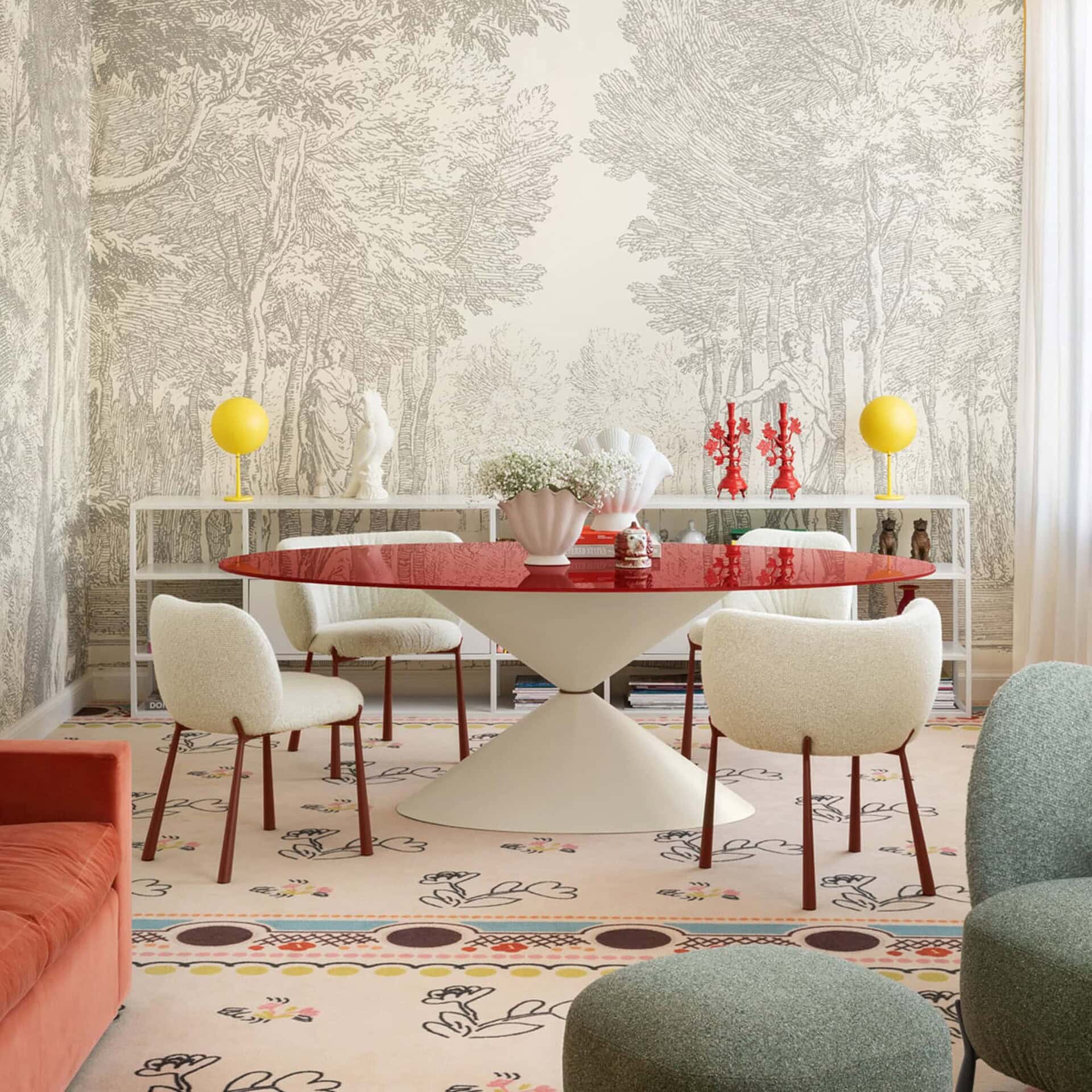 Bright dining room with modern furniture, artistic wallpaper, and colorful decor accents.