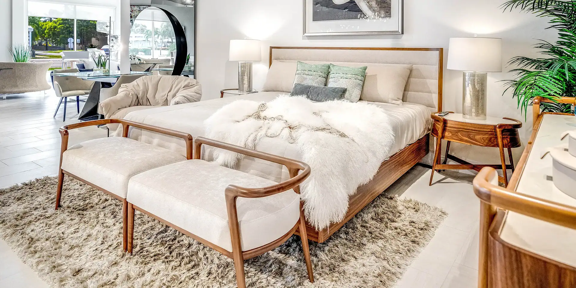 Contemporary bedroom with wooden furniture, plush bedding, and elegant lighting, featuring modern and minimalist design elements.