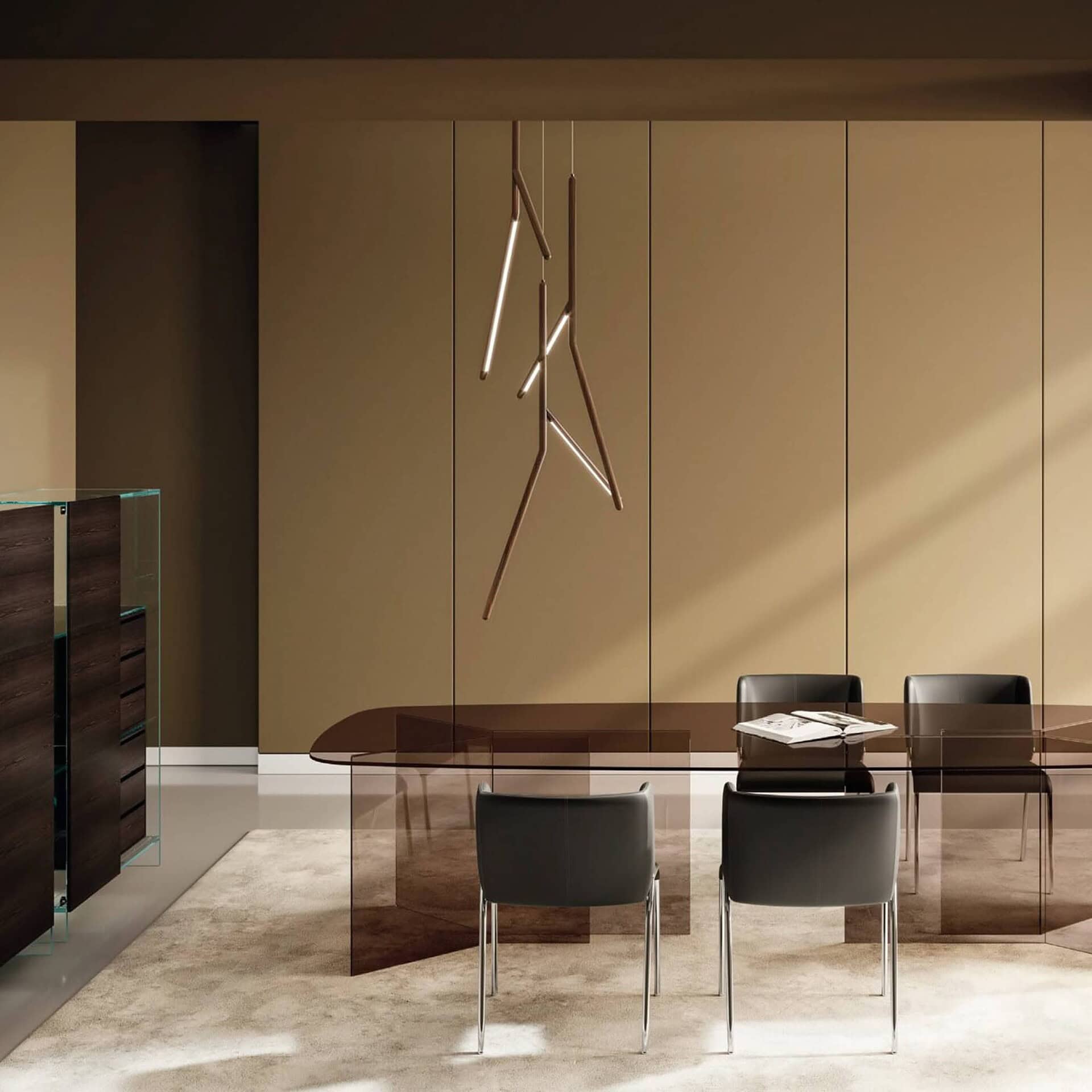 Sleek modern dining room with glass table and black chairs, stylish pendant lighting, and minimalist decor.