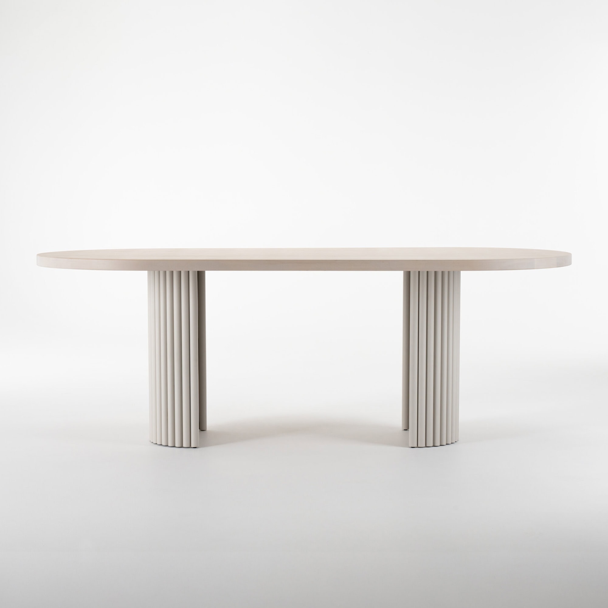 High-quality contemporary dining table with unique ribbed pedestal bases, perfect for elegant home dining.