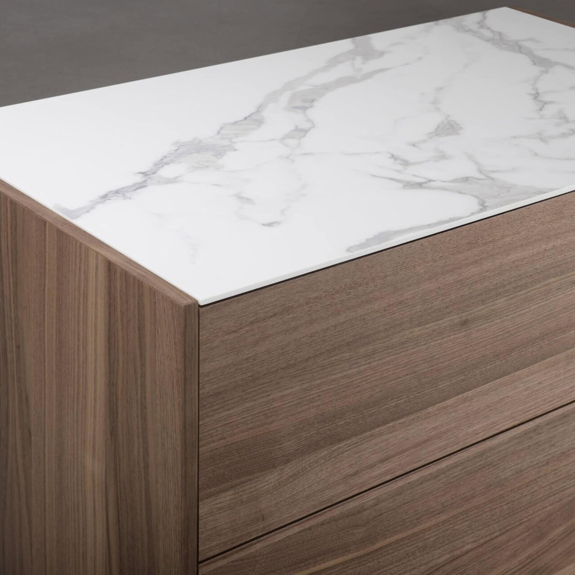 Elegant marble and wood nightstand with sleek modern design.