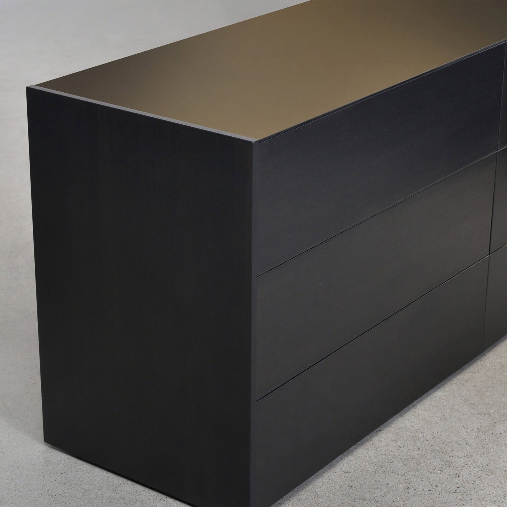 Sleek black modern dresser with minimalist design, ideal for contemporary bedroom decor.