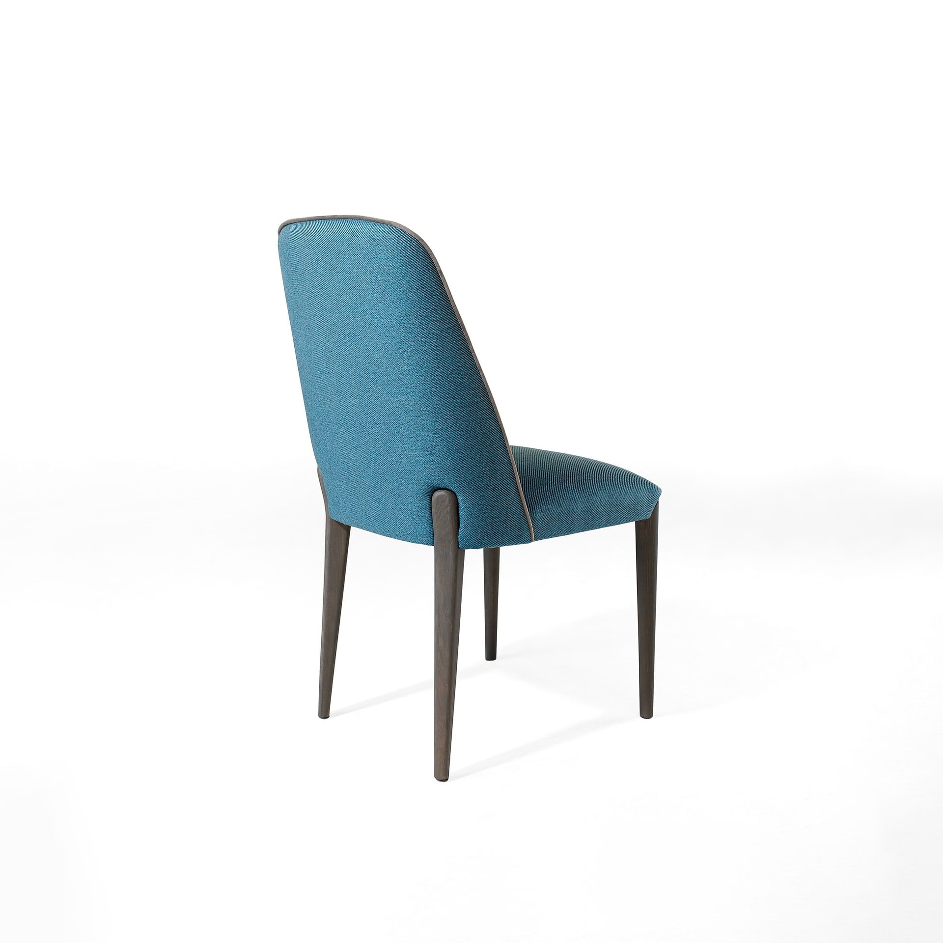Modern blue fabric dining chair with wooden legs for stylish dining room décor.