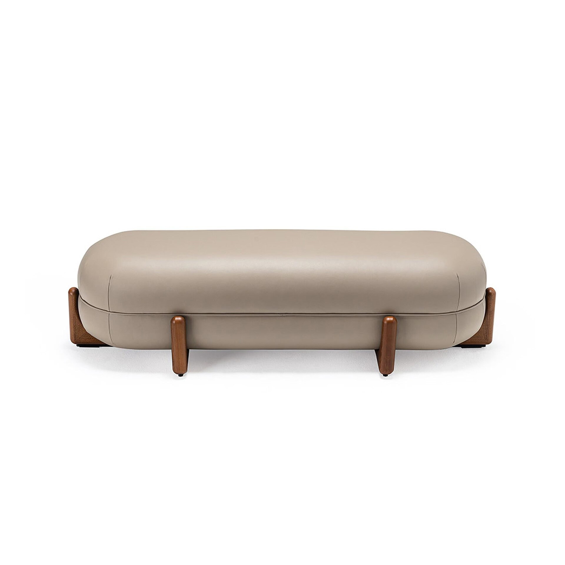 A long, pill-shaped taupe upholstered ottoman with rounded edges, supported by six short, dark wooden legs, on a white background.
