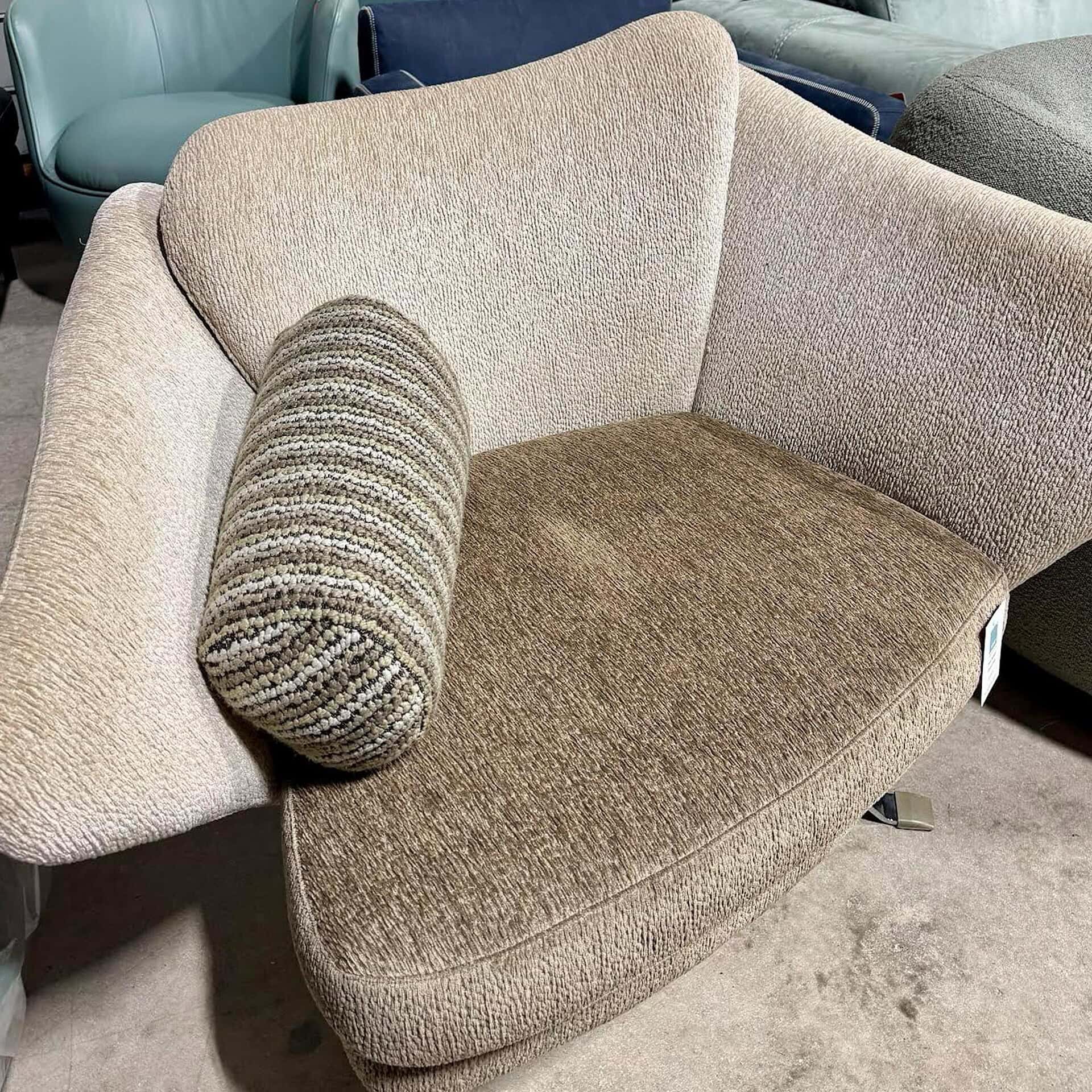 Comfortable beige and brown sofa with a textured fabric and a matching bolster pillow, perfect for modern living rooms.