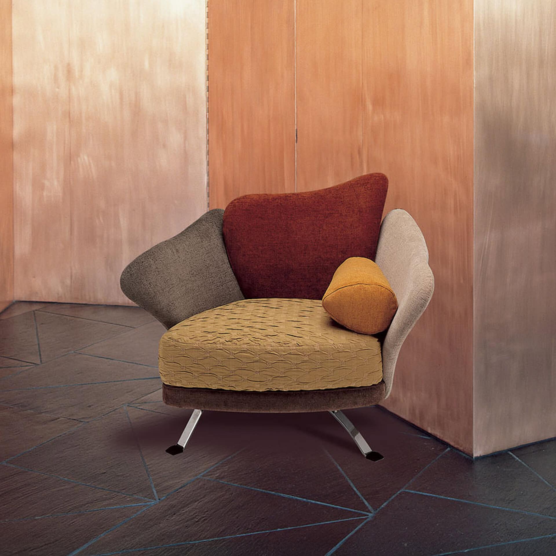 Contemporary upholstered lounge chair with colorful cushions, ideal for modern office or home decor.