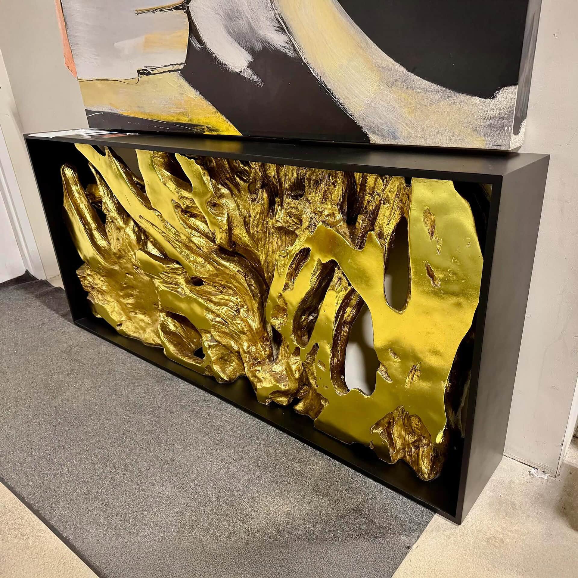 Stunning gold leaf decorative console table for modern interiors.