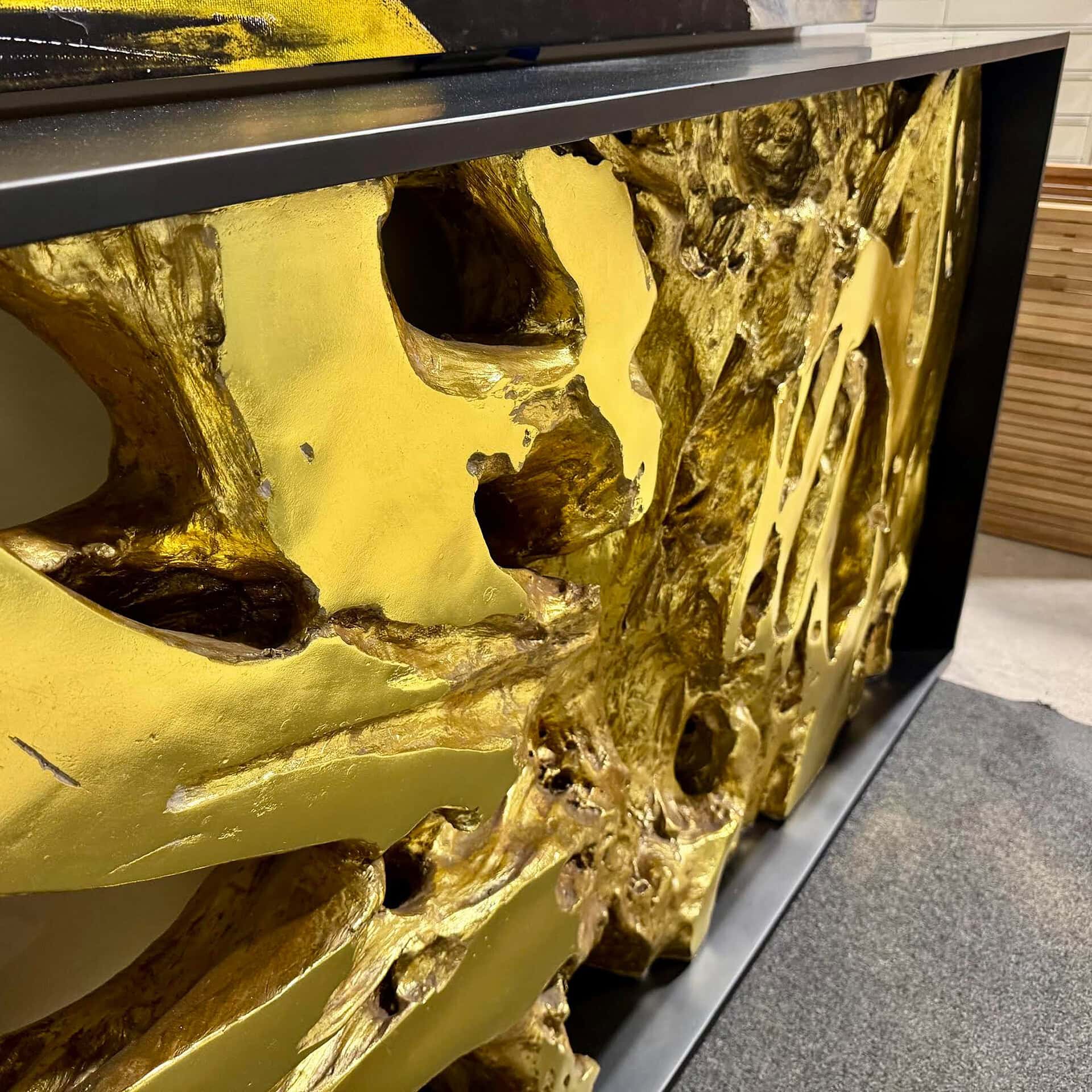 High-quality golden skull sculpture with intricate design by Sklar Furnishings.