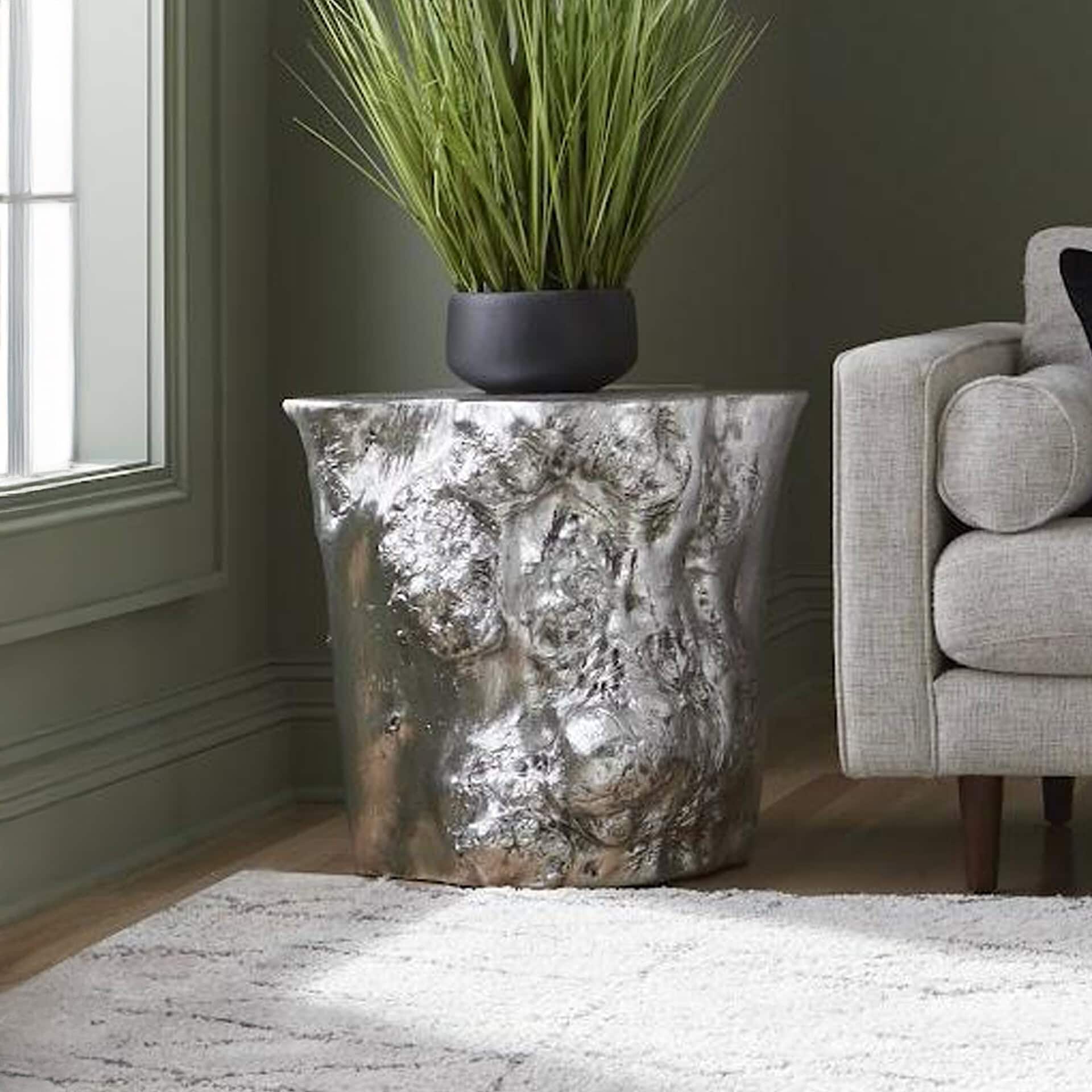 Glam silver side table with textured finish adds sophistication to modern interiors.