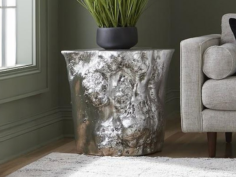 Stunning metallic textured accent table in a contemporary living room, perfect for stylish interior design.
