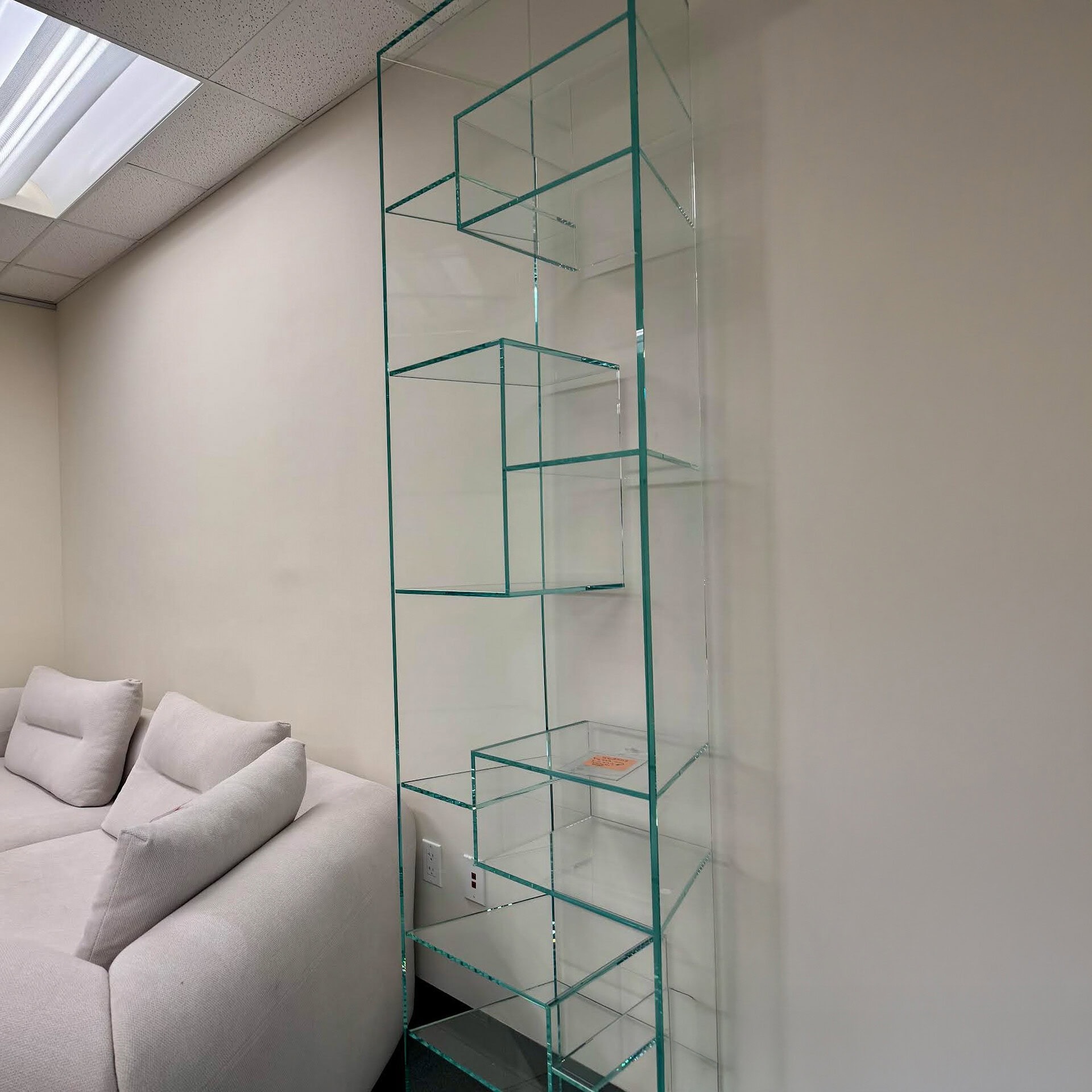 Elegant transparent glass shelving for stylish interior decor.