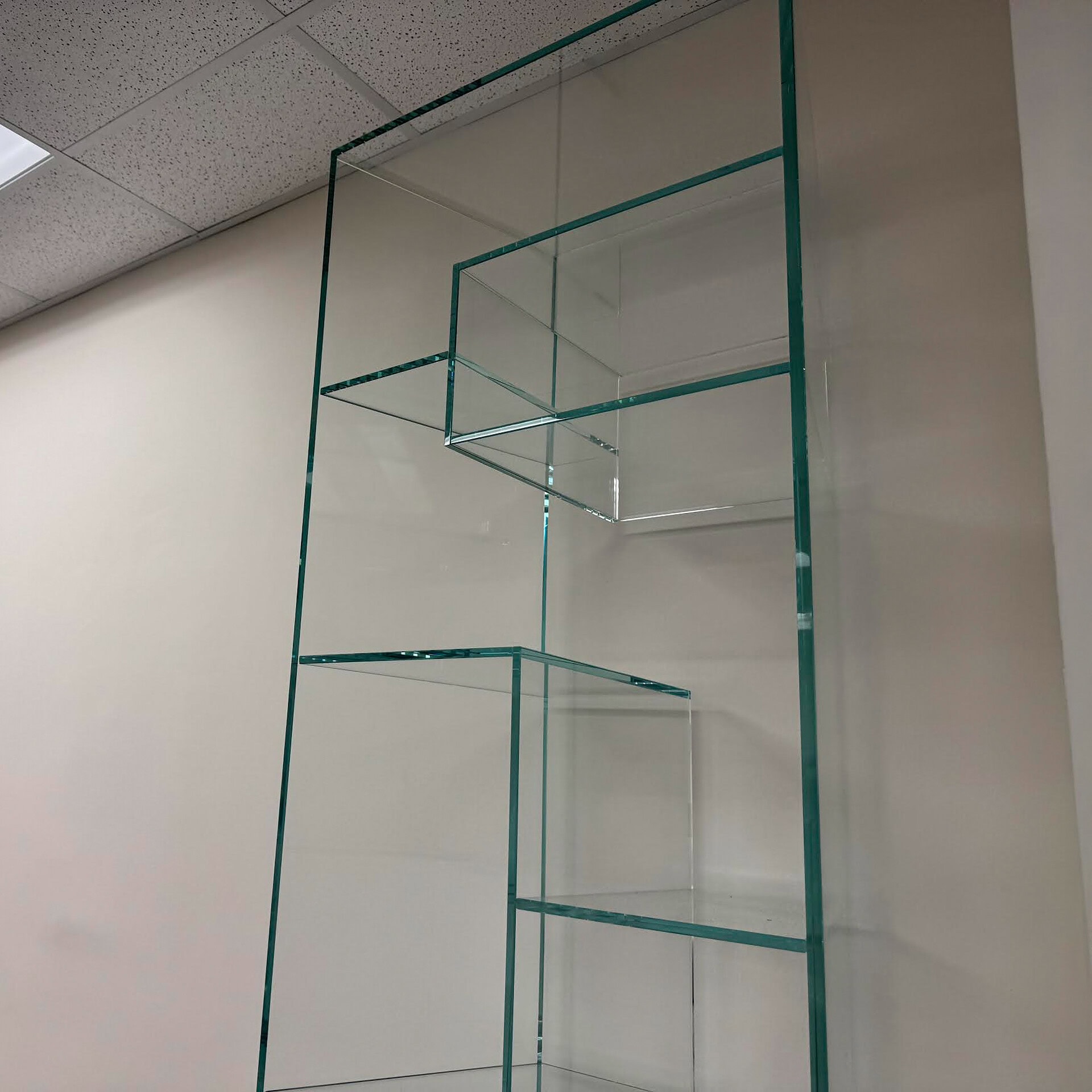 Stunning glass shelving display perfect for stylish living or office spaces.