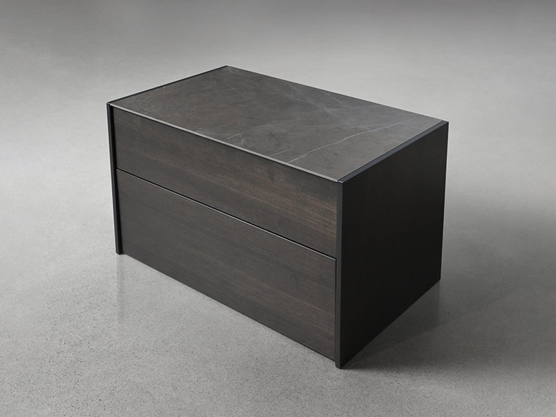 Elegant dark wood nightstand with marble surface, perfect for modern bedroom decor.