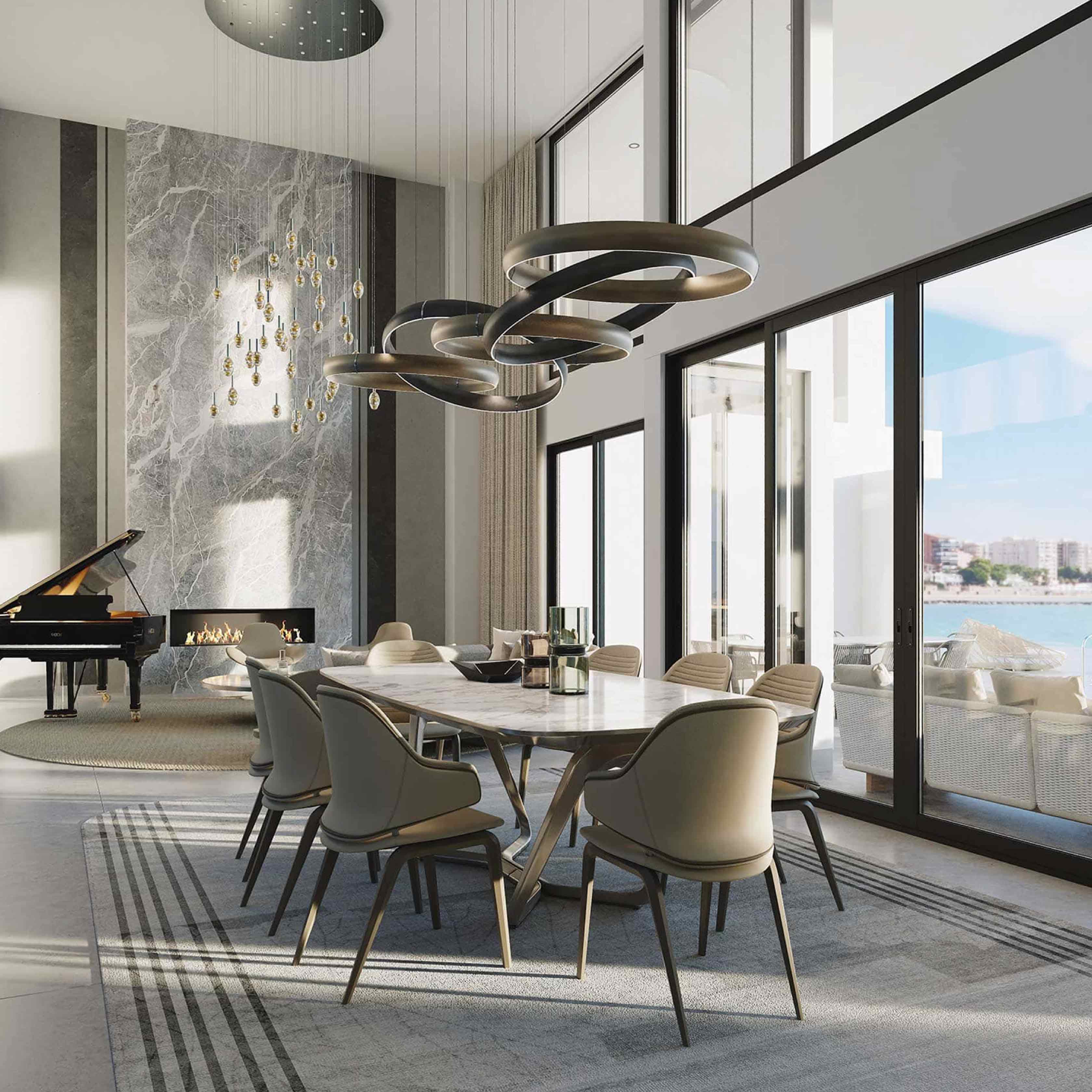 A luxurious open-concept dining and living room with a marble fireplace, grand piano, modern chandeliers, and floor-to-ceiling windows overlooking the ocean and a city skyline.