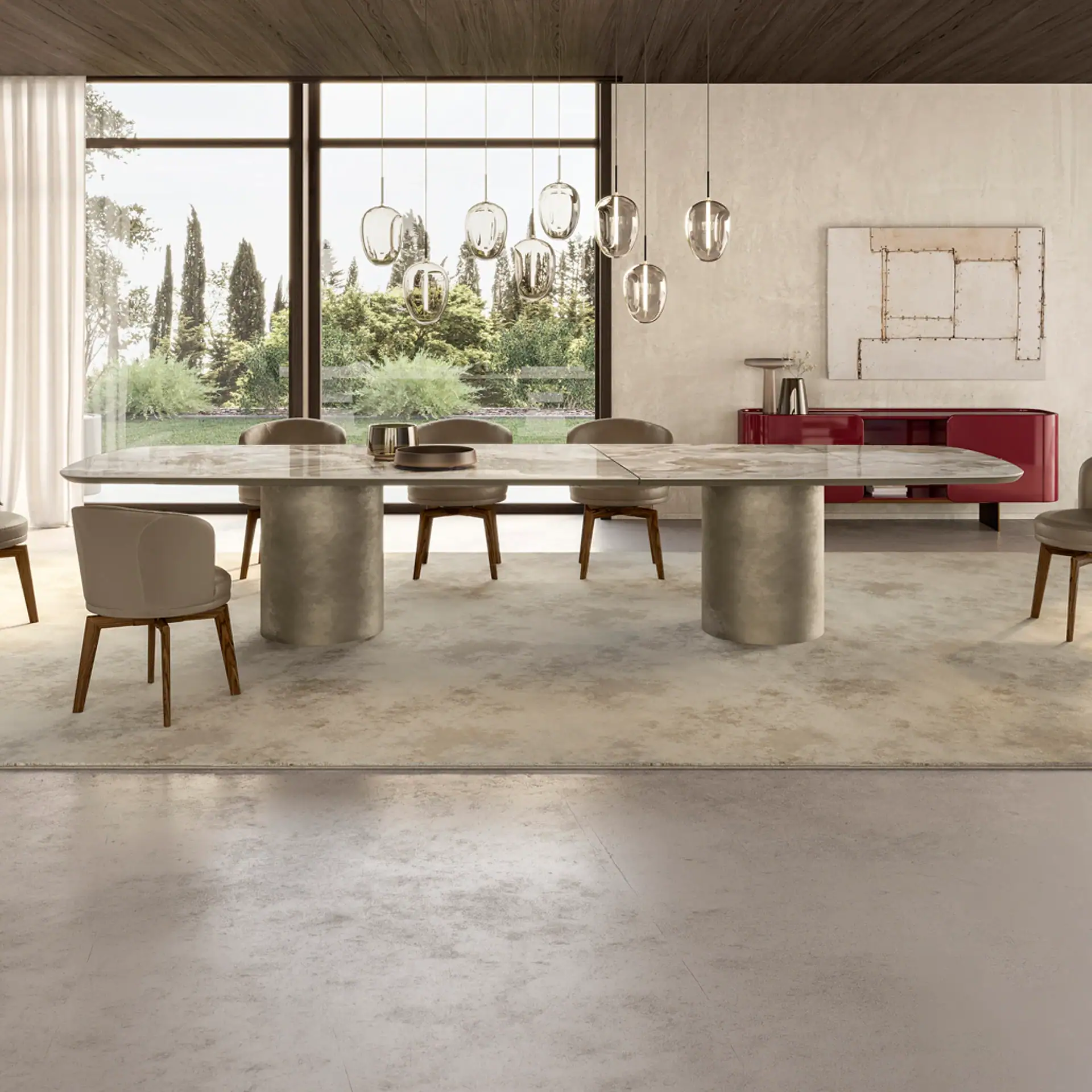 Cilindro Modern Dining Table with chairs in a spacious room.