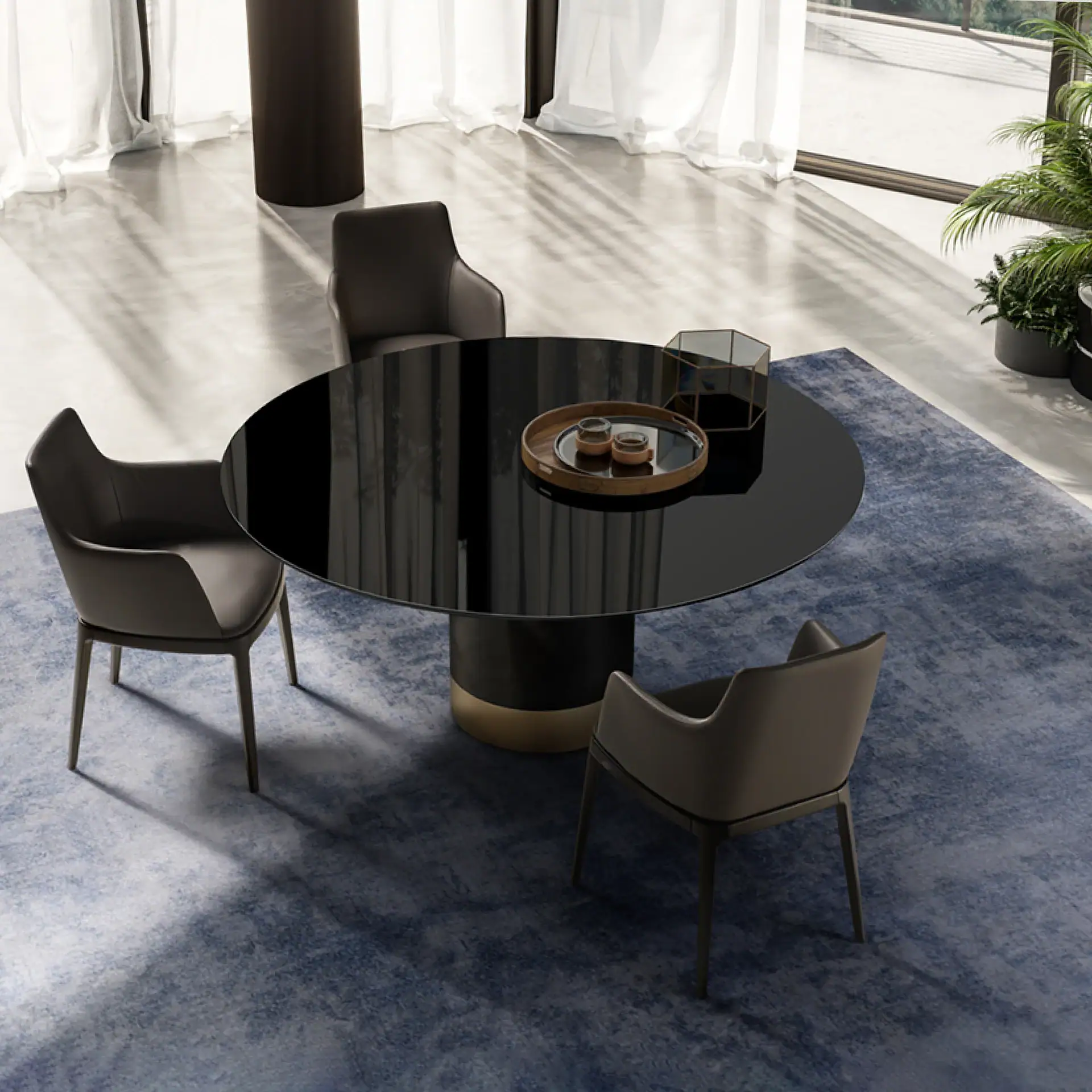 Cilindro modern dining table with four chairs in a bright room.