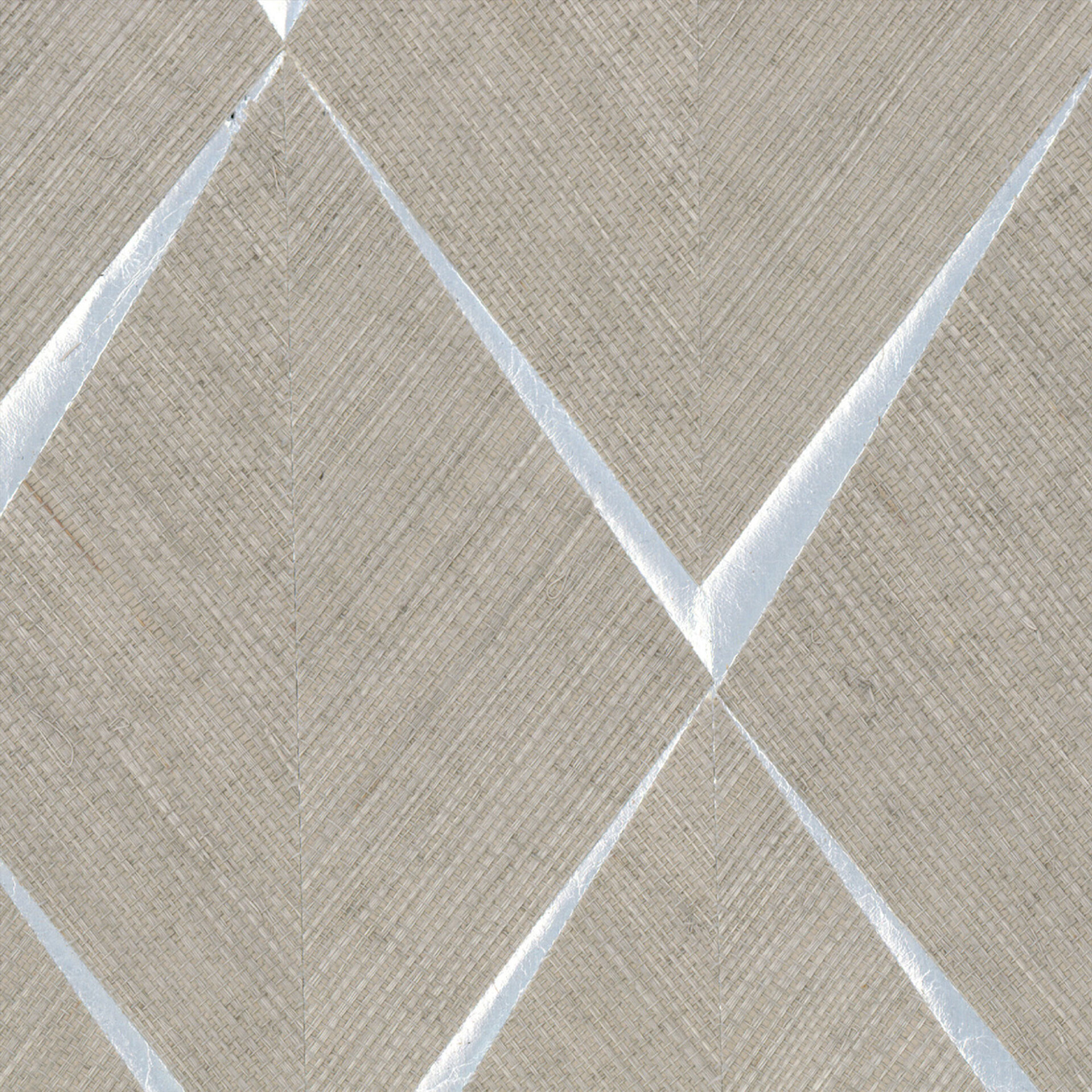 Textured surface with a geometric pattern of light beige woven fabric and reflective silver lines forming a zigzag design.