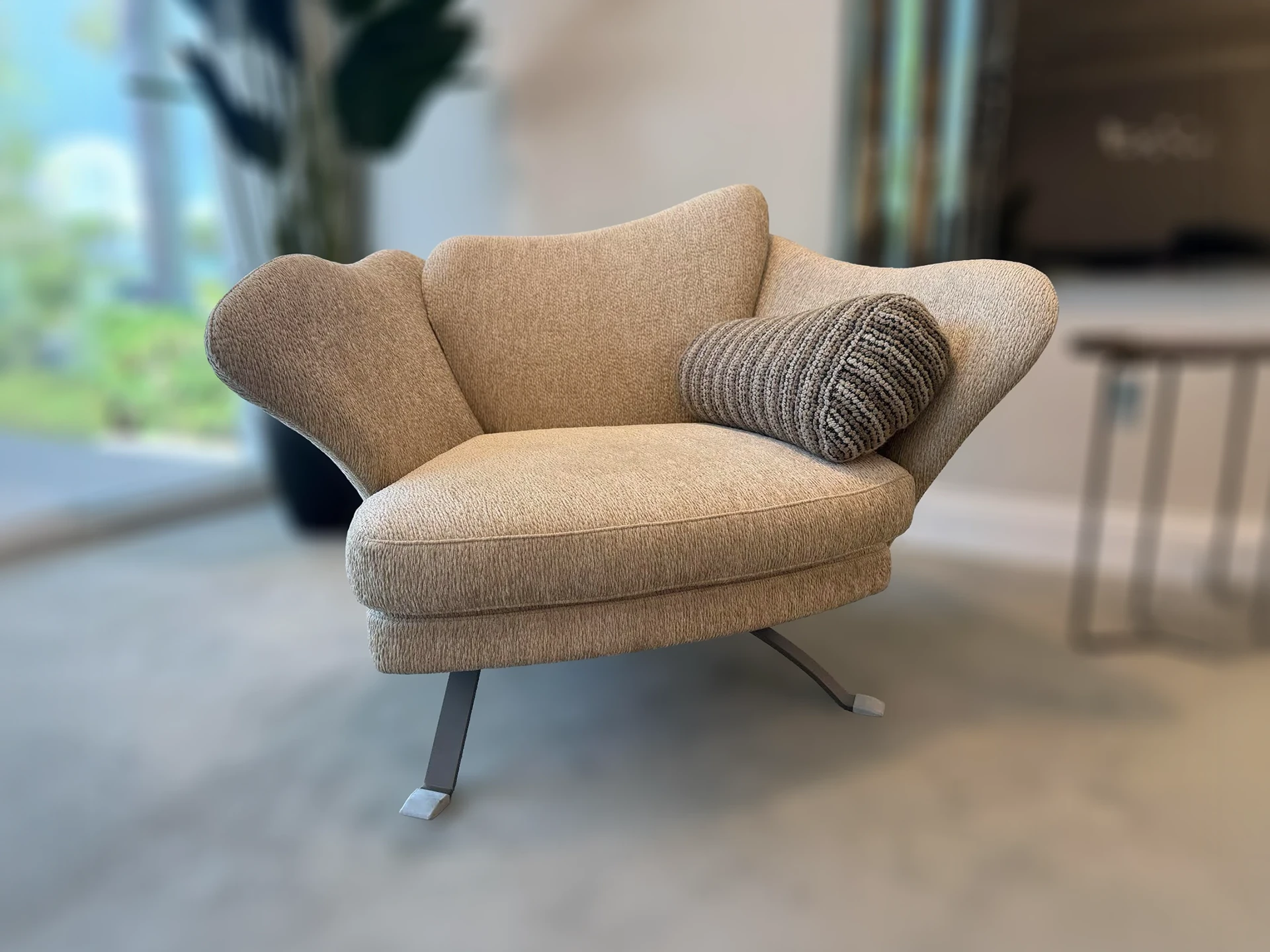 Sklar Furnishings Flower Armchair with cushion in a living room.