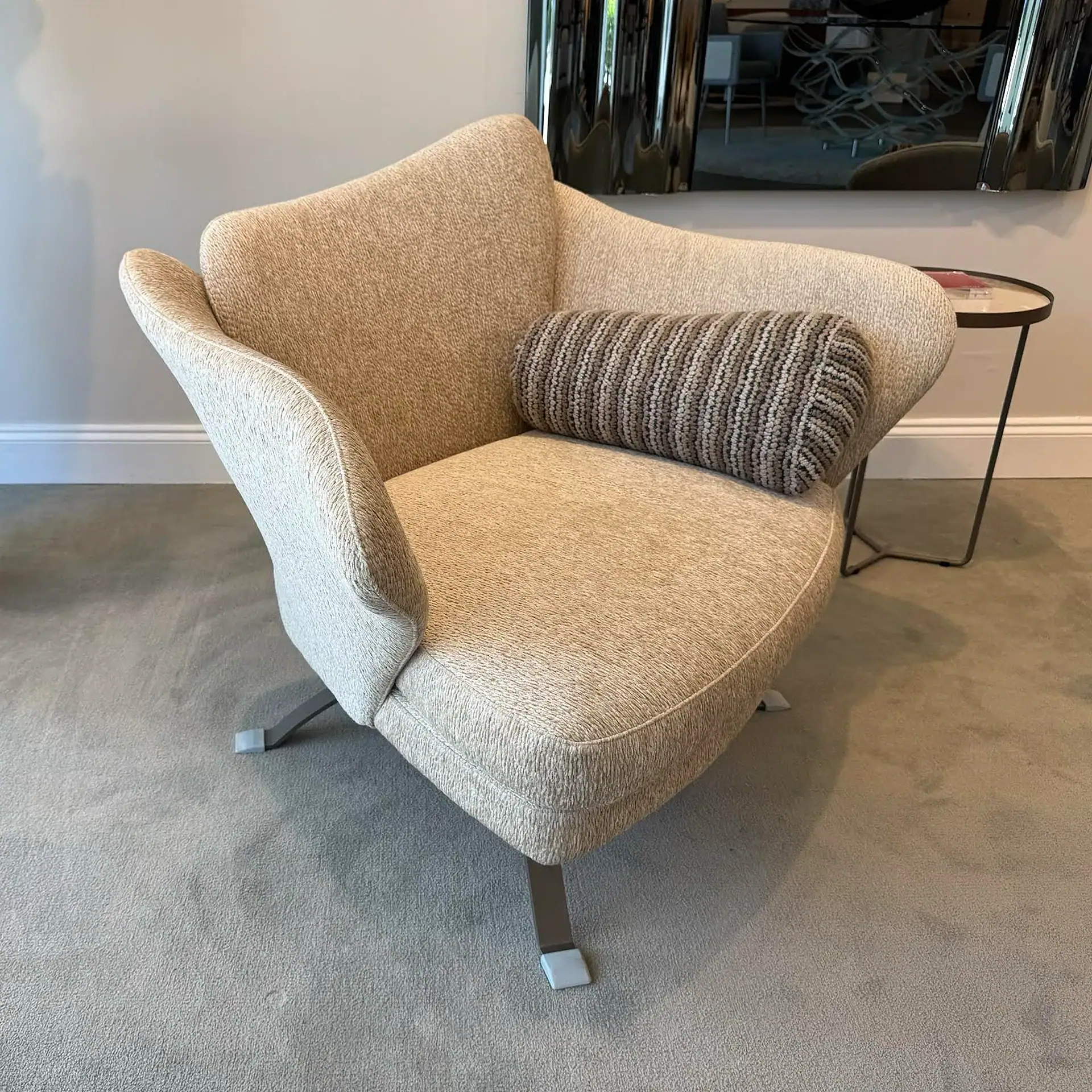 Sklar Furnishings Flower Armchair with cushion in a modern room.
