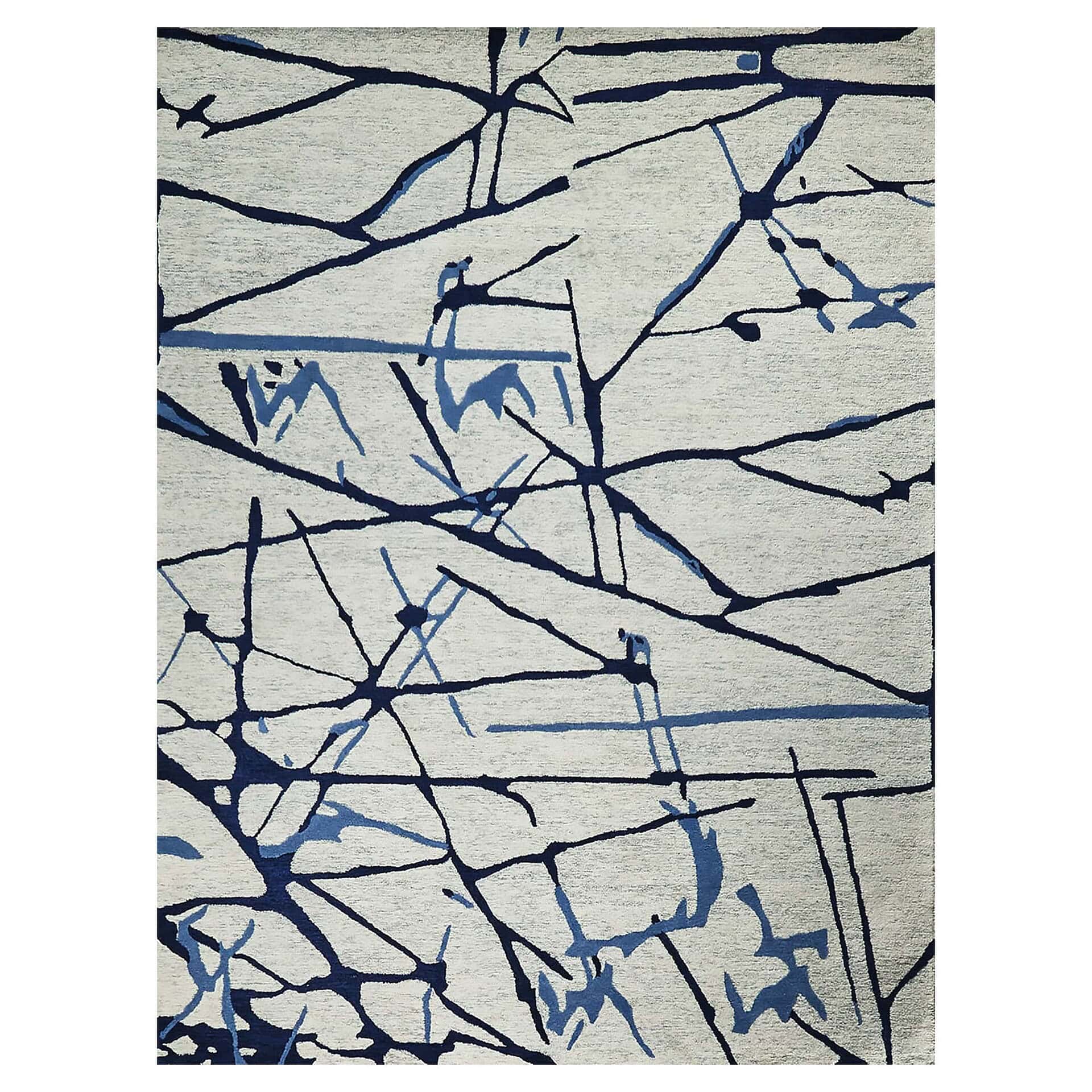 Abstract rug with dark and light blue organic lines and shapes on a light gray background.